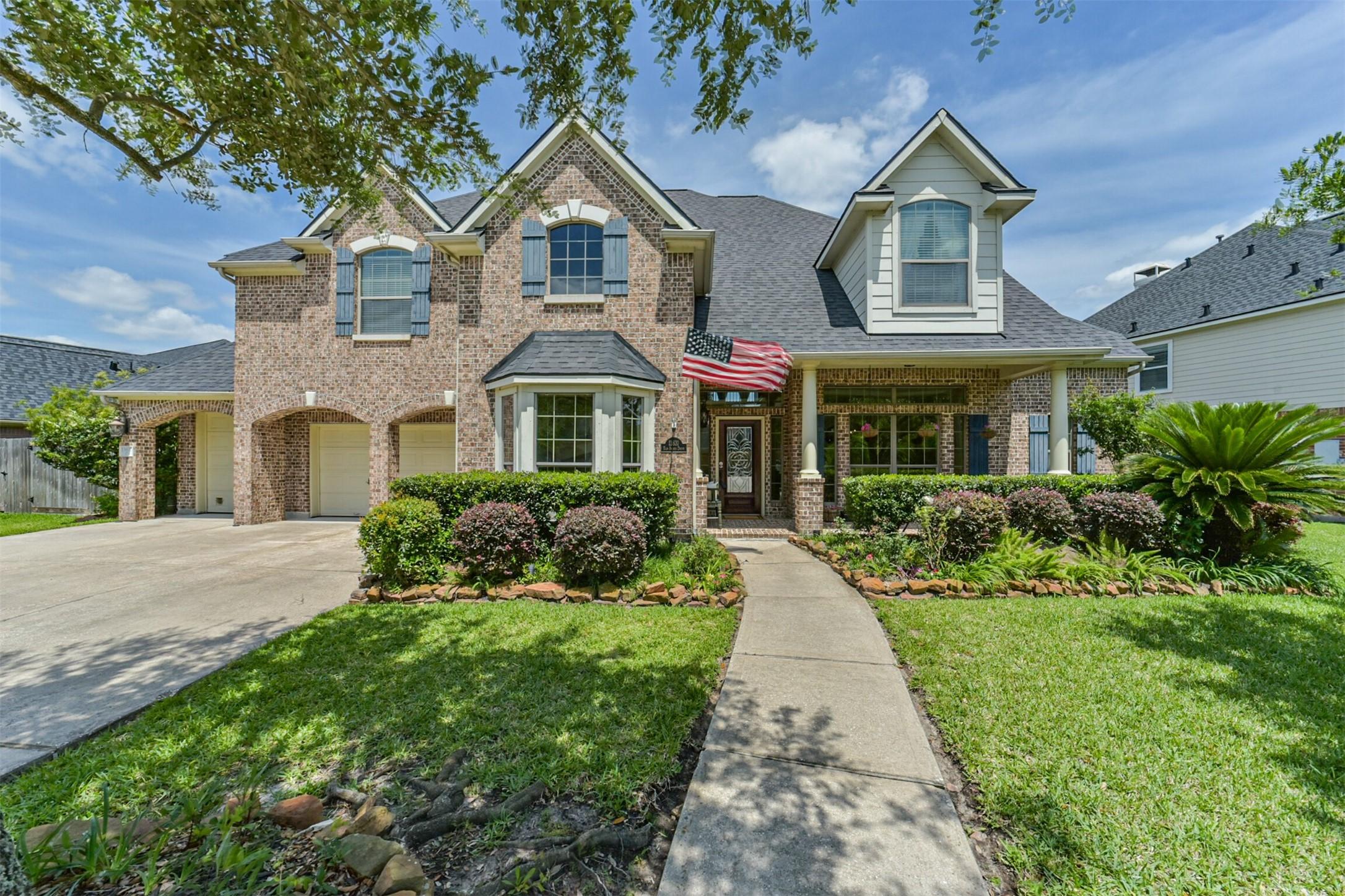 Image 1: Well-maintained home featuring classic architectur