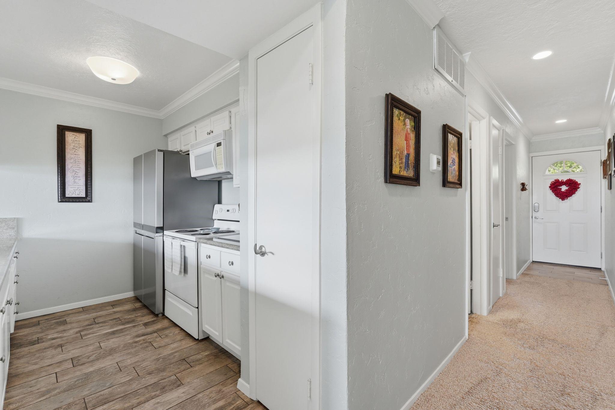 Image 4: Hallway leading to kitchen and living area