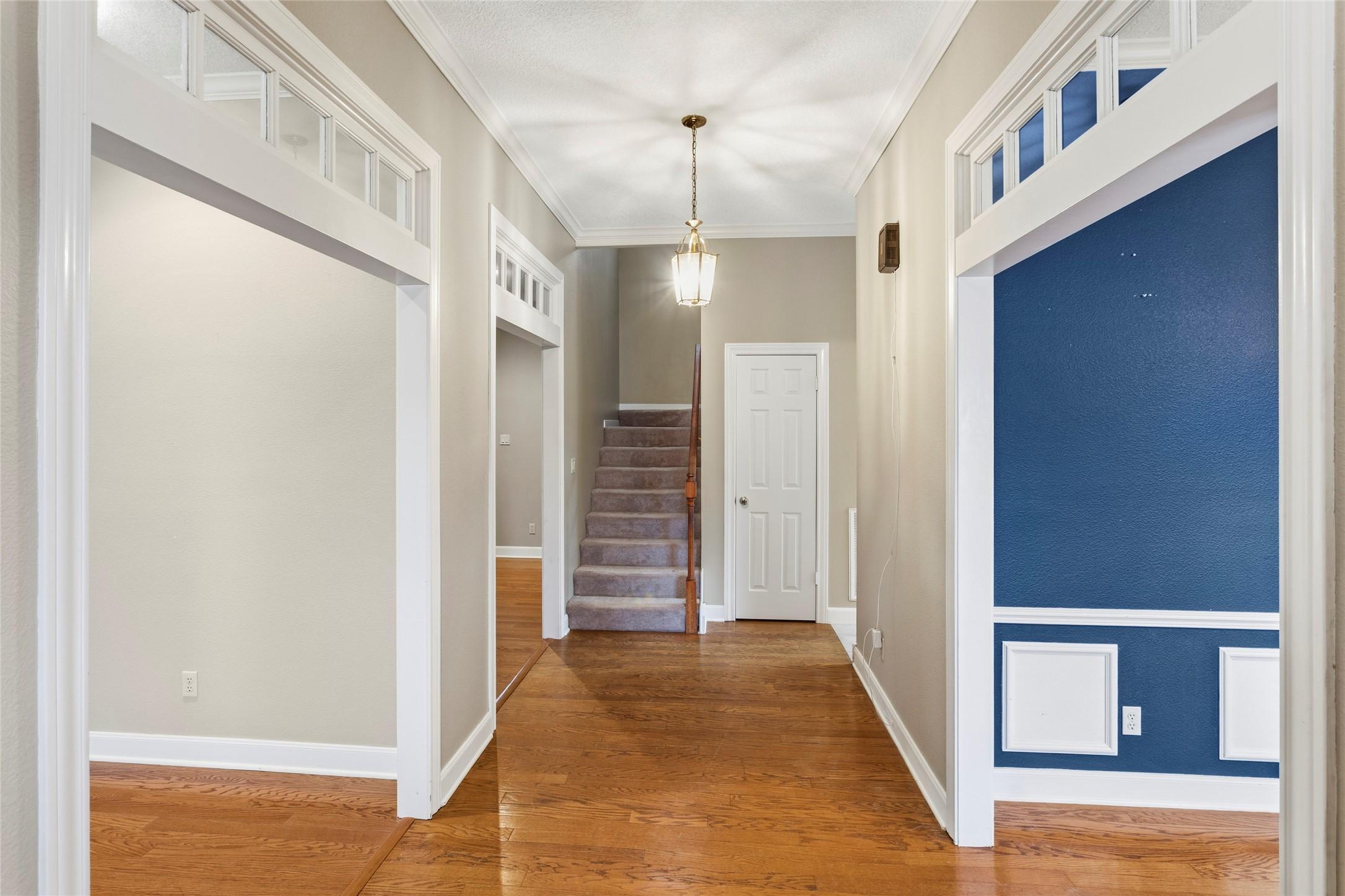 Image 3: A welcoming foyer with high ceilings sets the tone