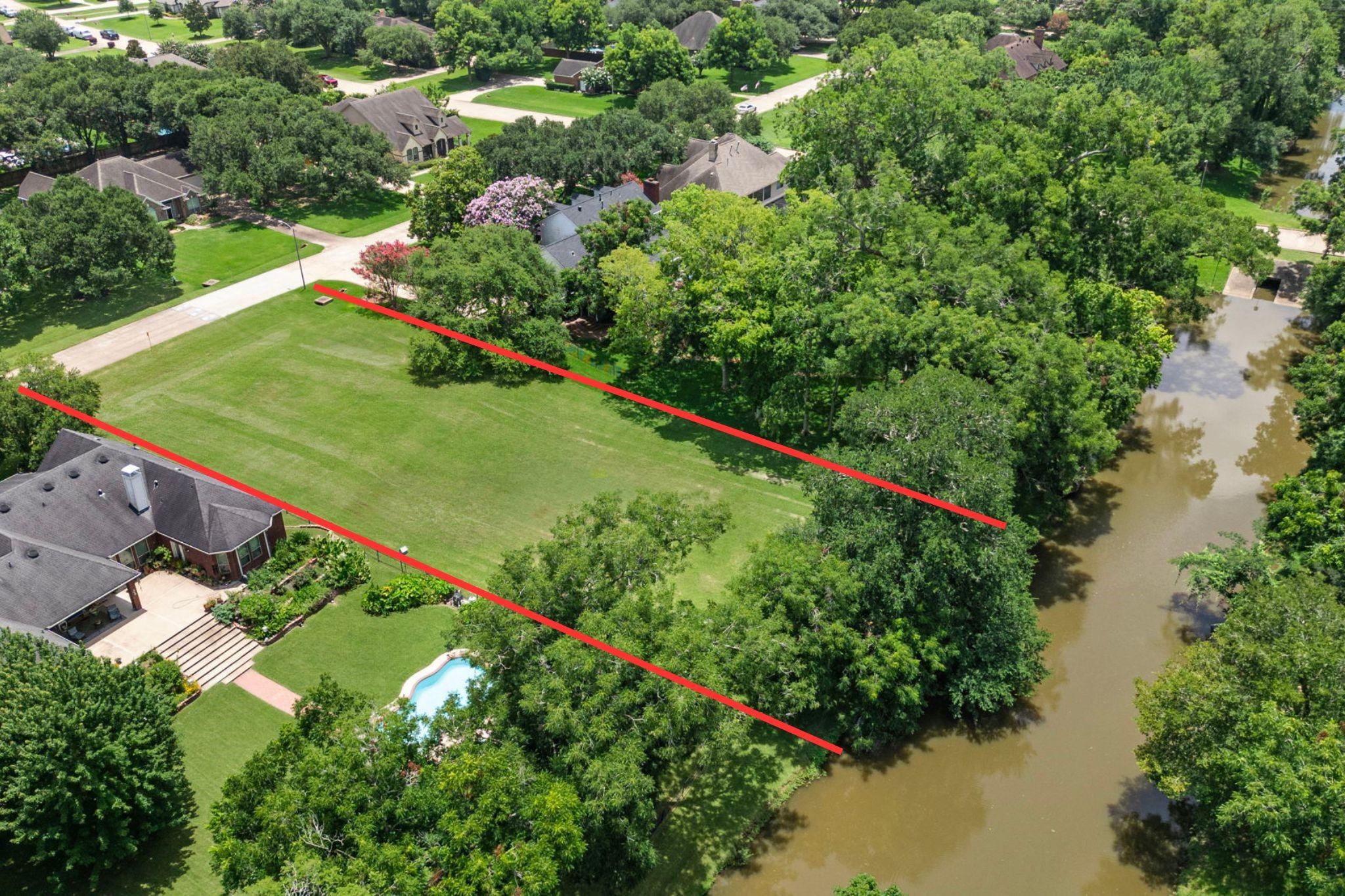Image 2: This rare .64-Acre Lot backs to Pecan Lake and off