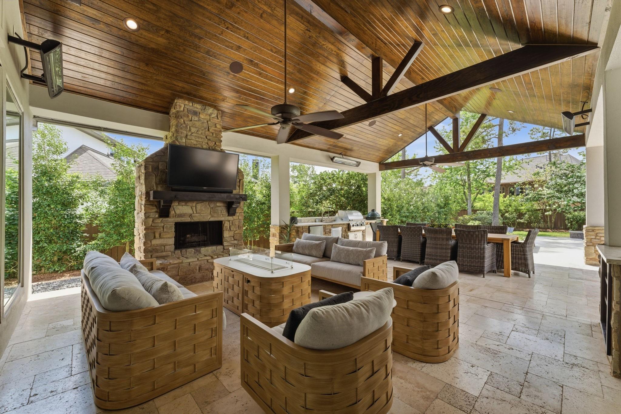 Image 3: Resort-style outdoor living with a vaulted wood ce
