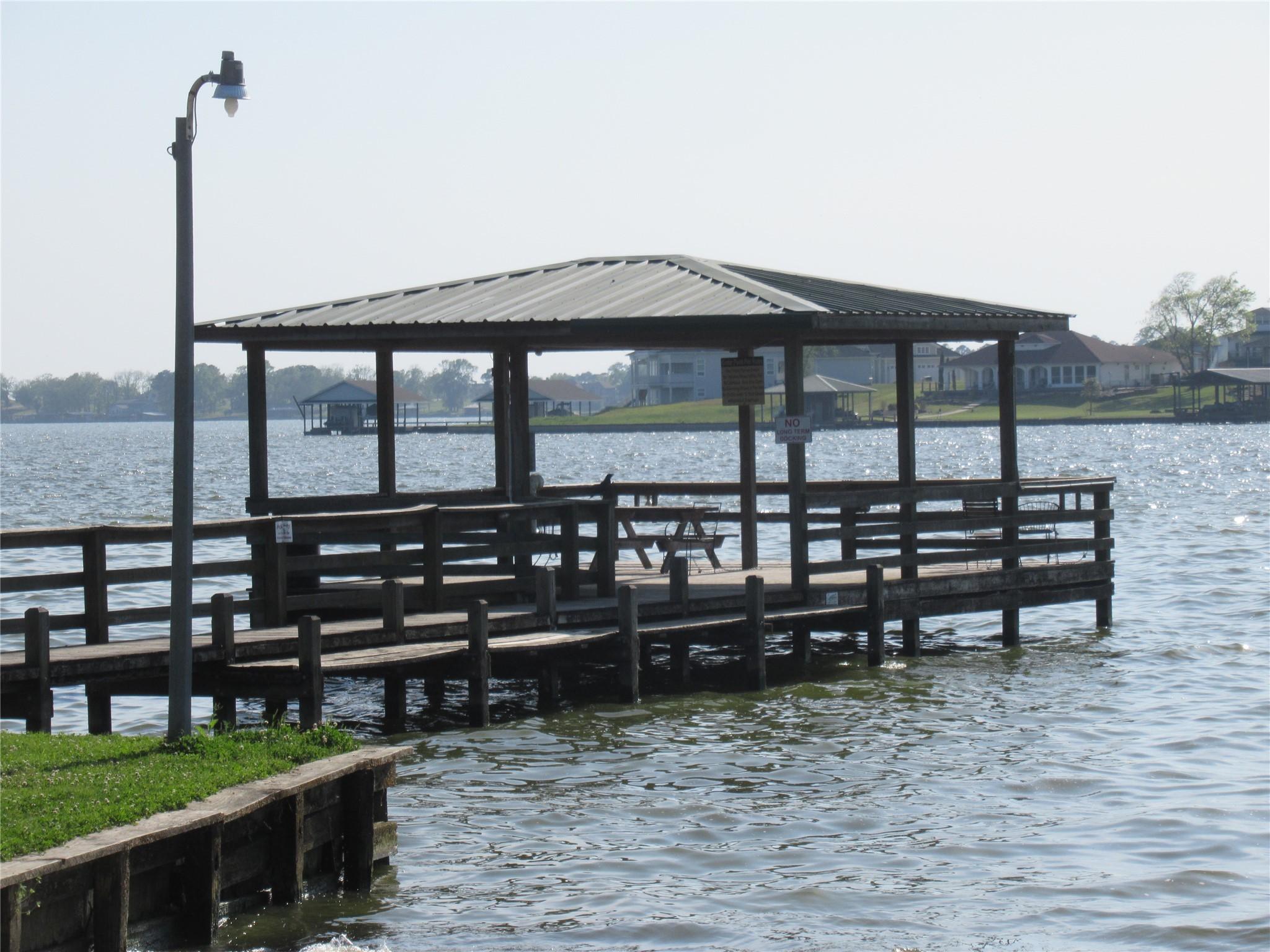 Image 1: Subdivision has a covered fishing dock.