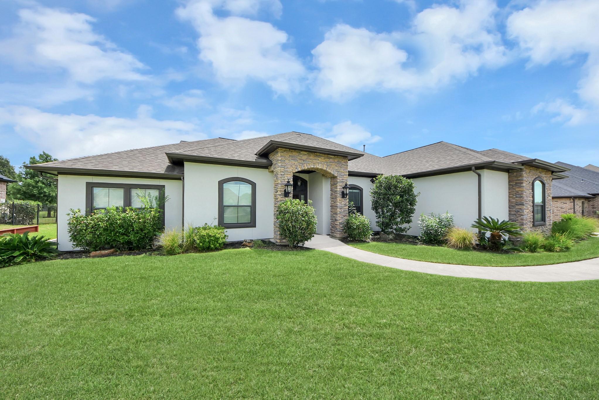 Image 4: Charming single-story home with modern stone accen
