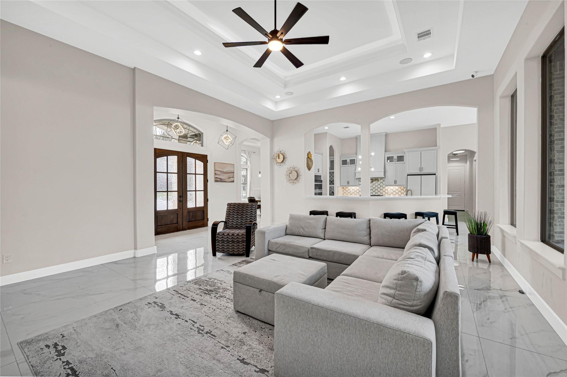 Image 2: View of living, entry, Formal Dinning and Kitchen