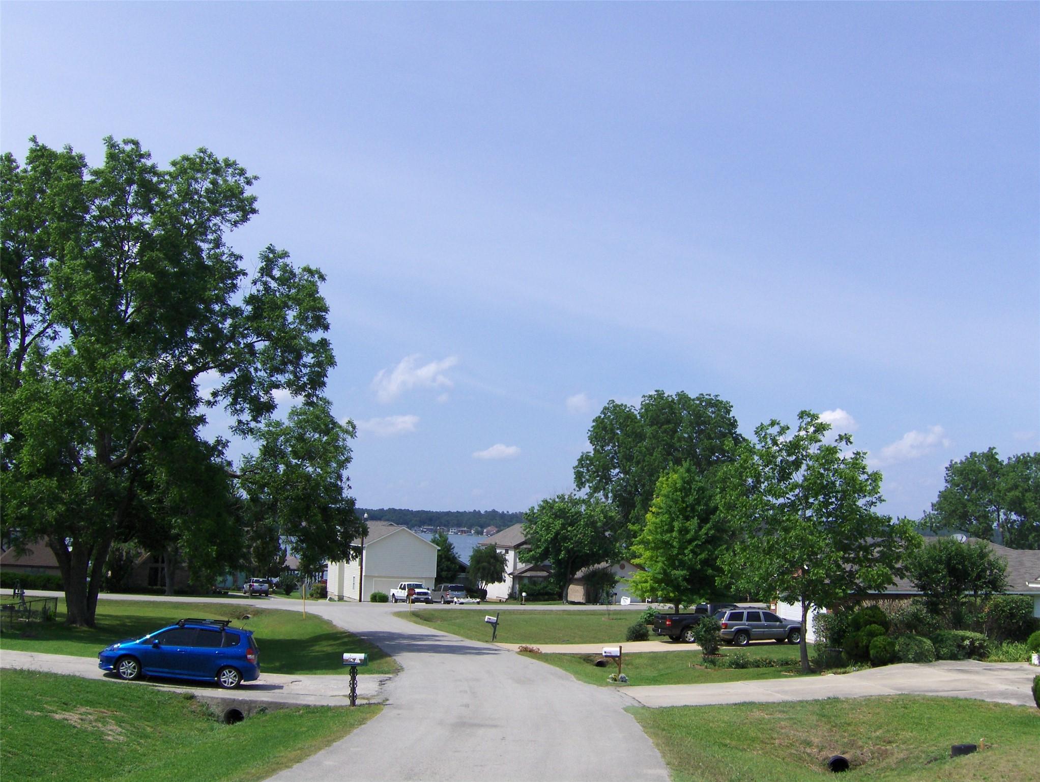 Image 4: View from the street looking towards Lake Conroe