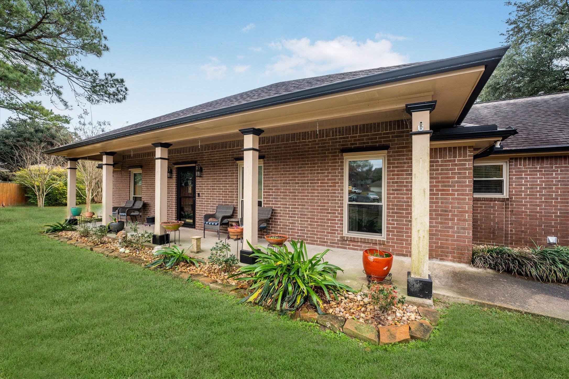 Image 4: Charming covered porch adds comfort and curb appea