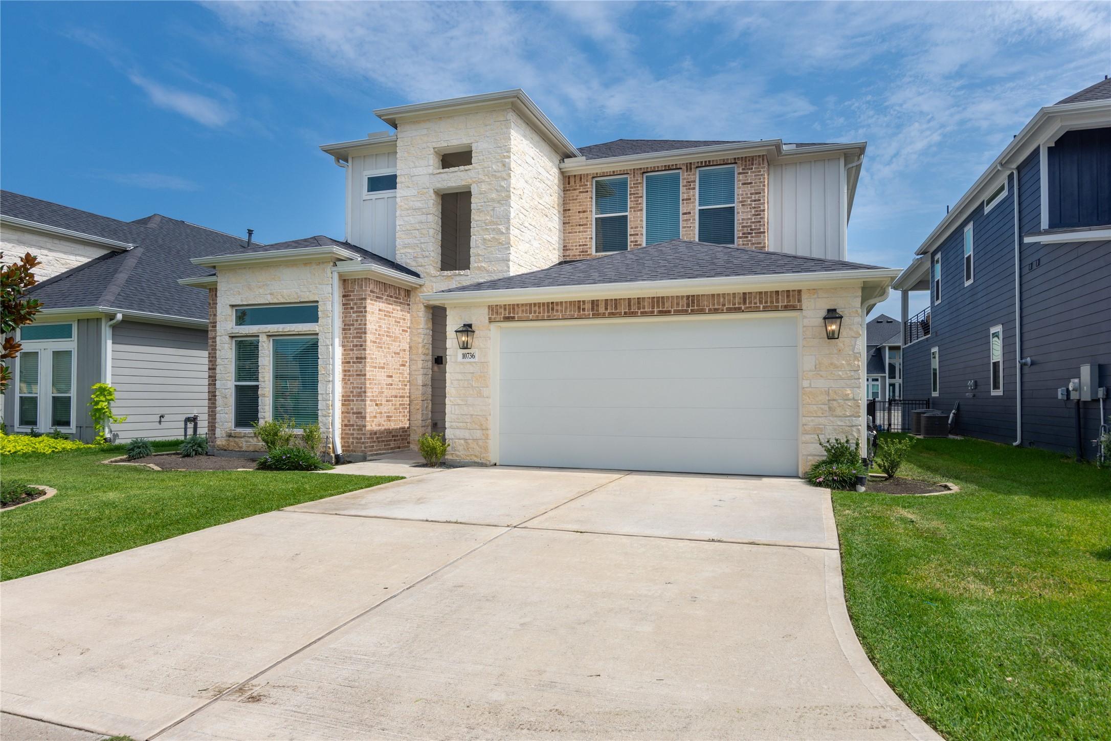 Image 2: This stunning two story home boasts a modern blend