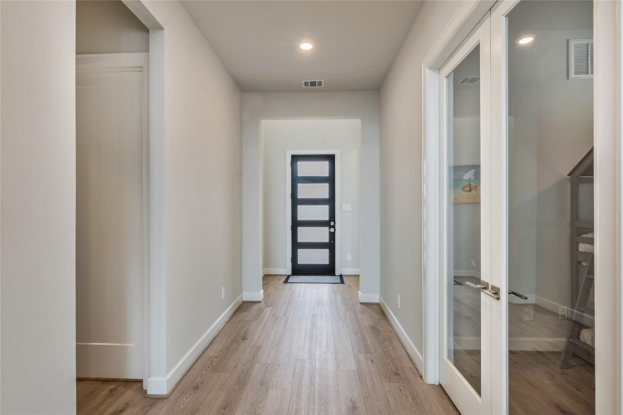 Image 3: Inside, you're greeted with a bright and airy hall