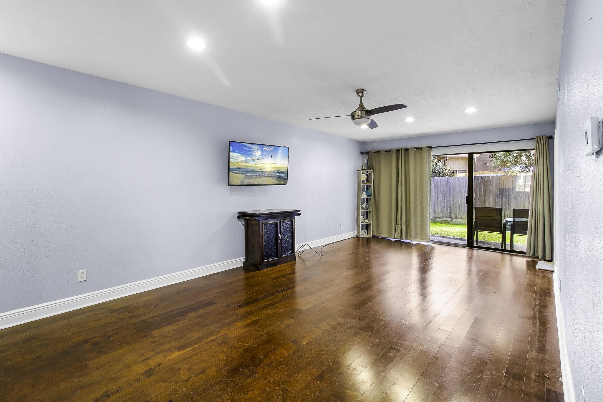 Image 4: Living Room with Sliding Doors leading to Private