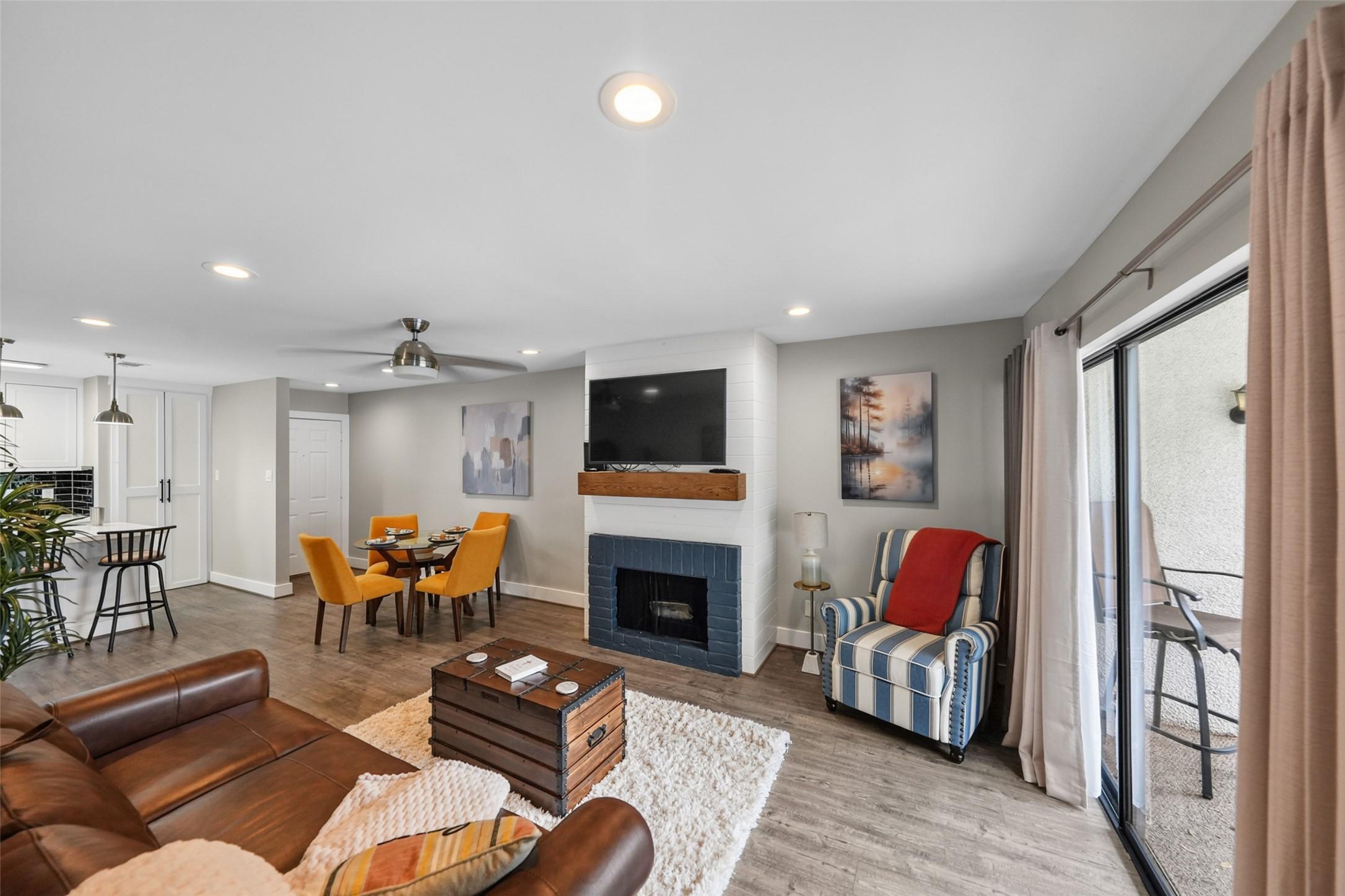 Image 3: This inviting living space features a cozy firepla
