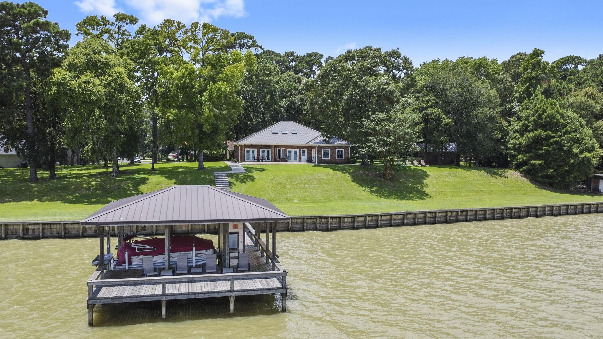 Image 1: Welcome to your lakefront sanctuary, a beautifully