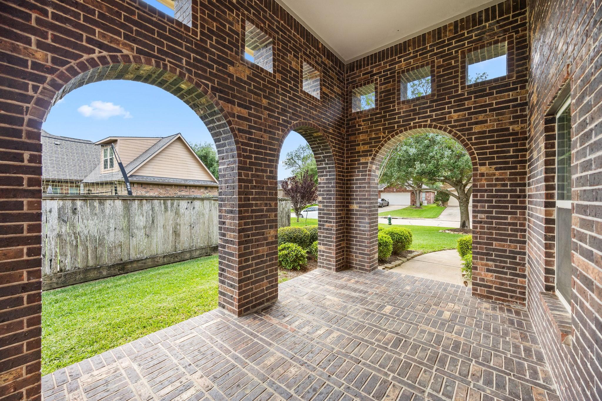 Image 4: This photo features the beautiful brick archways a