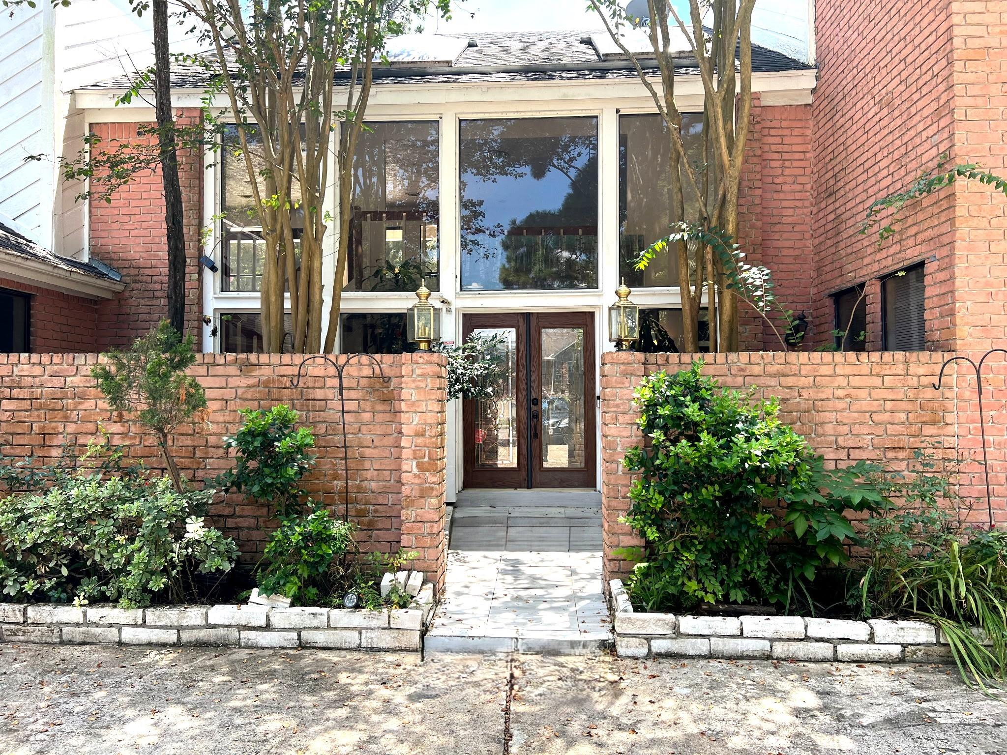 Image 1: A double door with leaded glass welcomes you to th