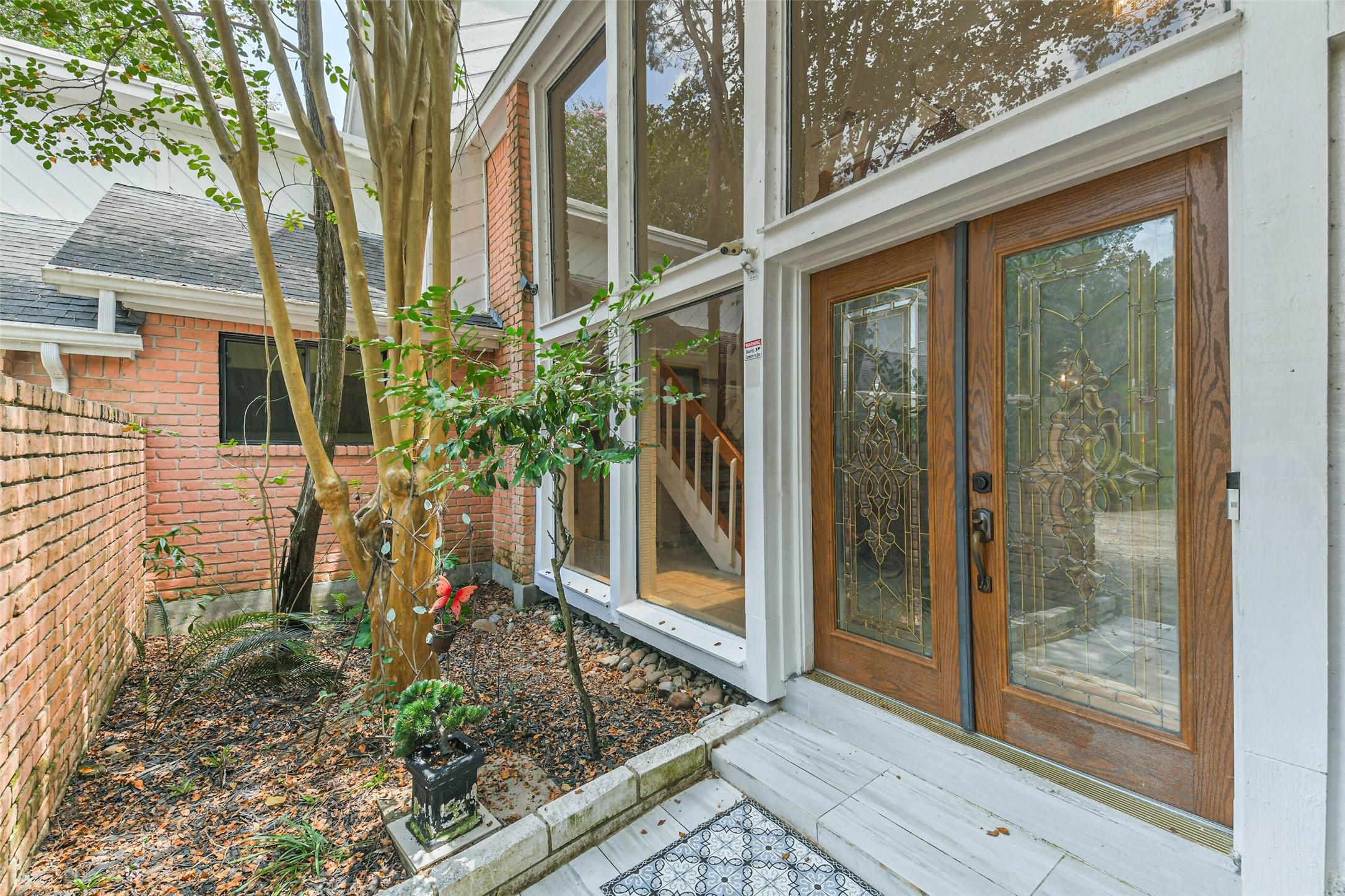 Image 4: The front facing partially enclosed brick courtyar