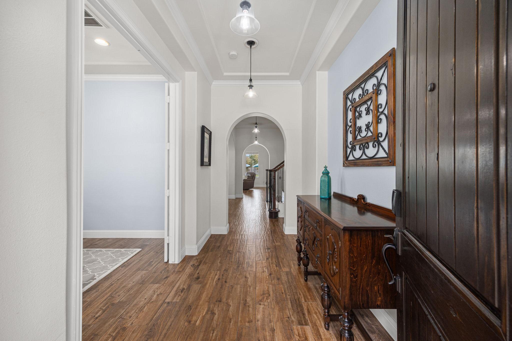 Image 3: As guests enter, they are greeted by gorgeous wood