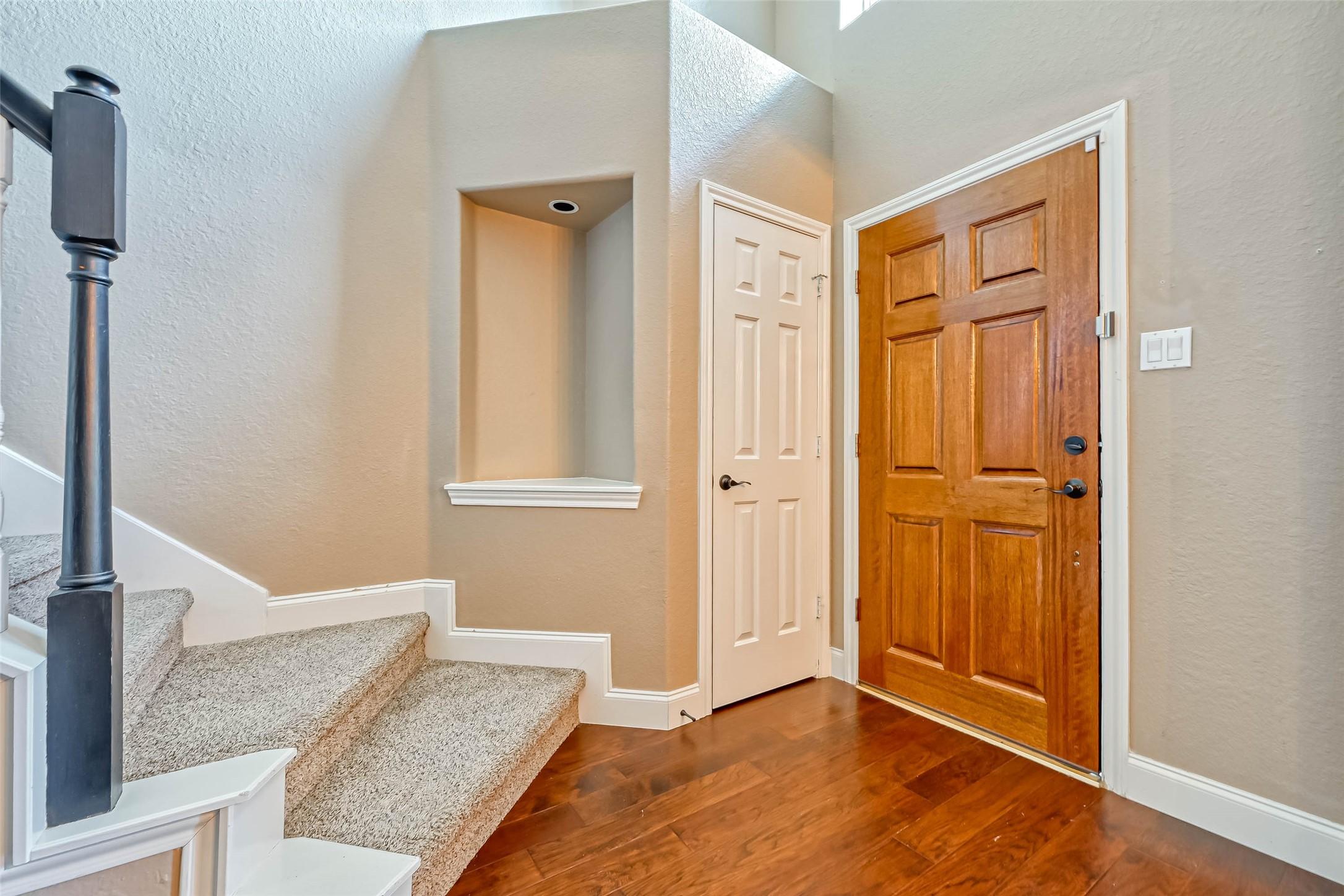 Image 4: The foyer opens up into a flowing open floorplan.