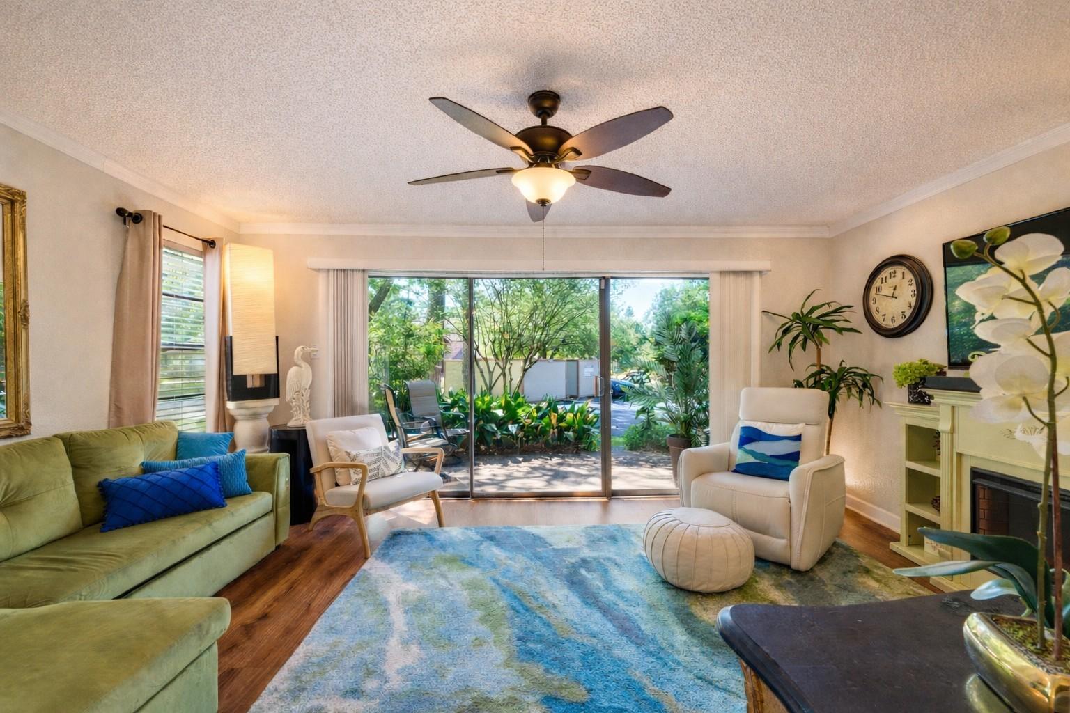 Image 1: This inviting living room features a large sliding