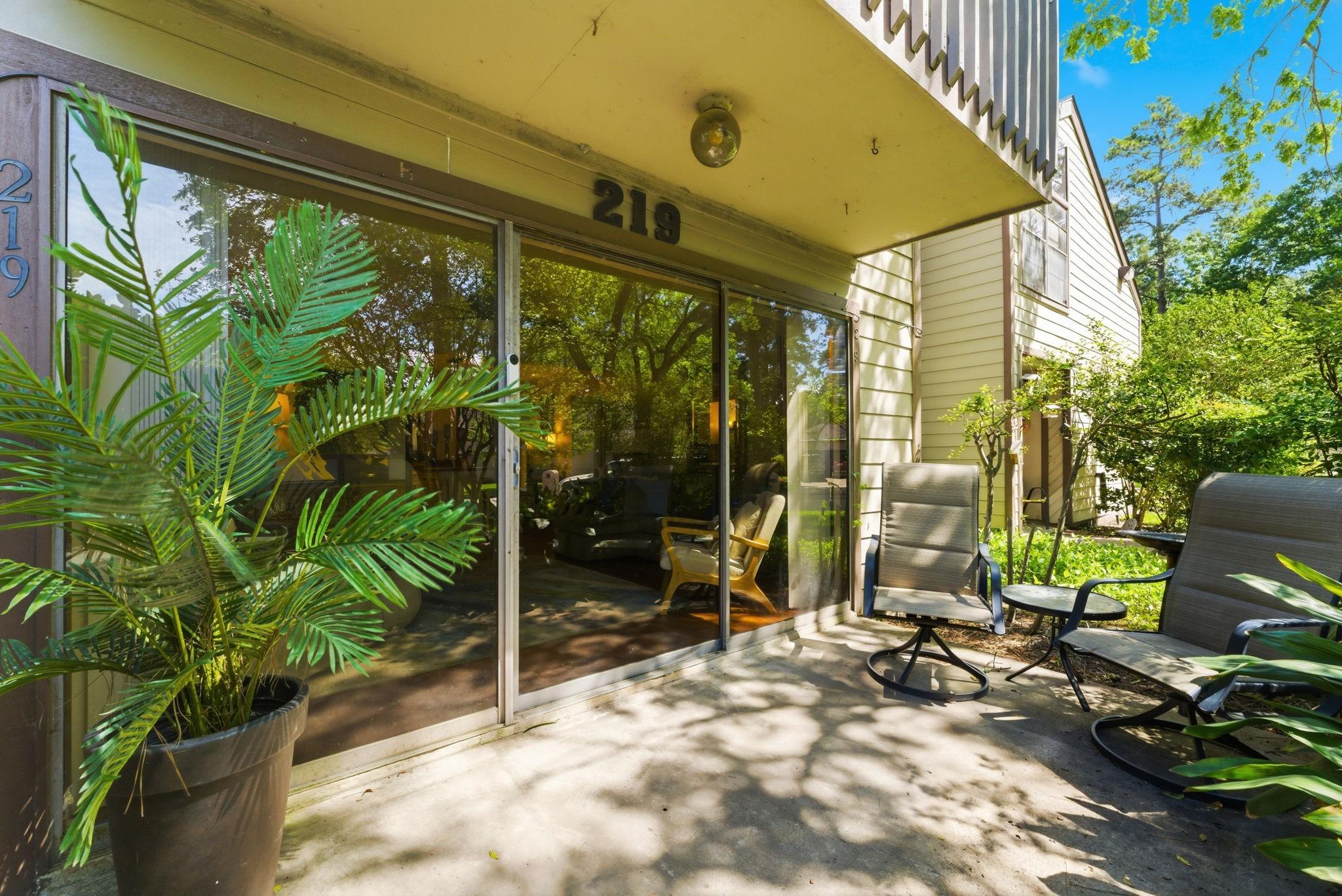 Image 2: This photo showcases a cozy patio area with slidin