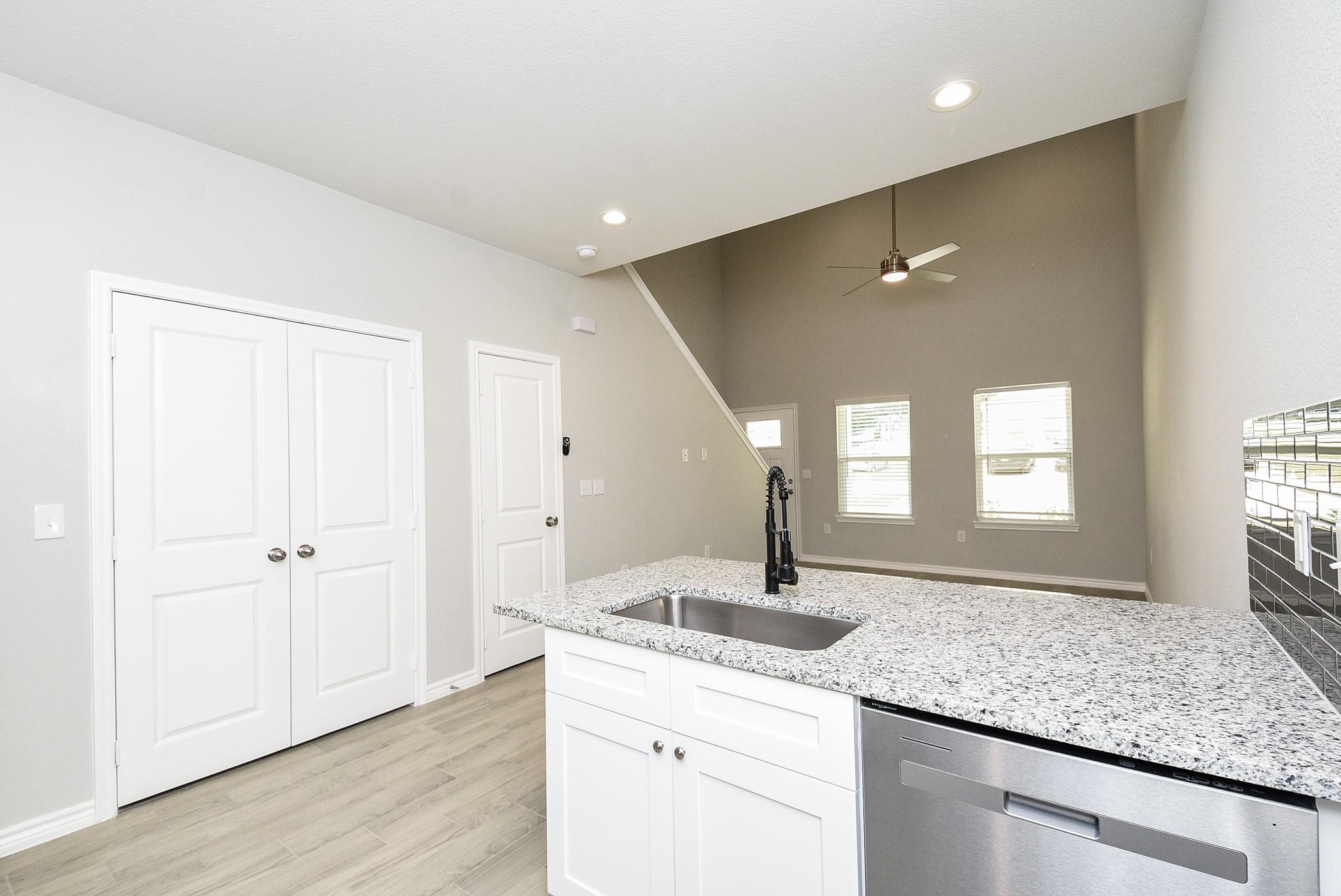 Image 4: View from kitchen to the spacious living area