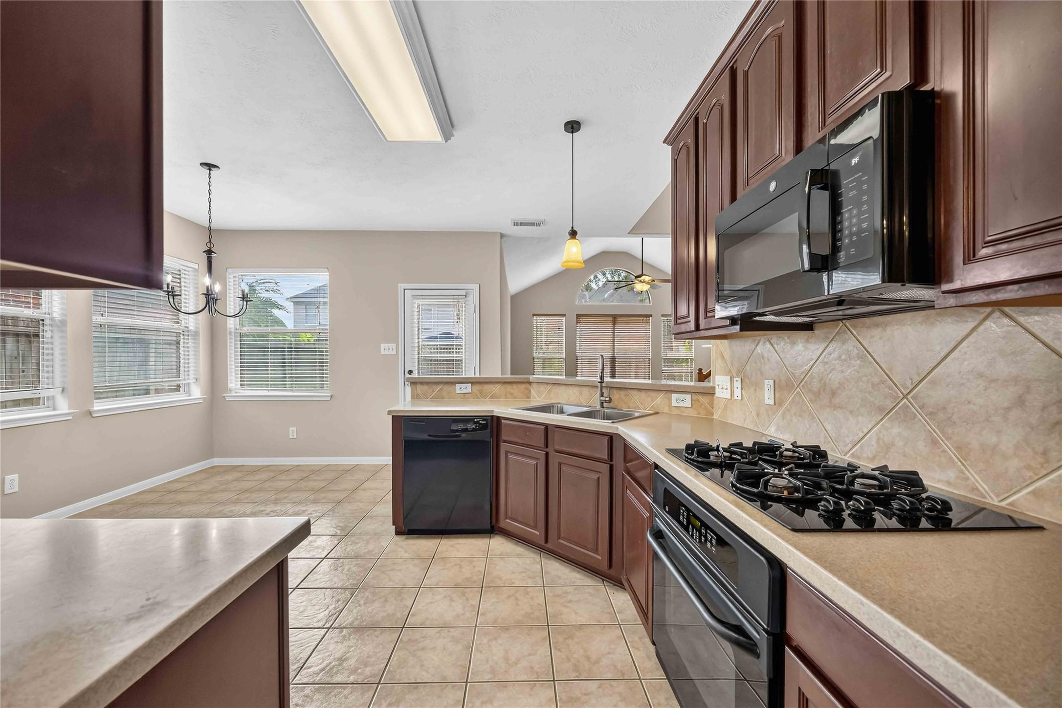 Image 4: A bright and spacious kitchen with elegant cabinet