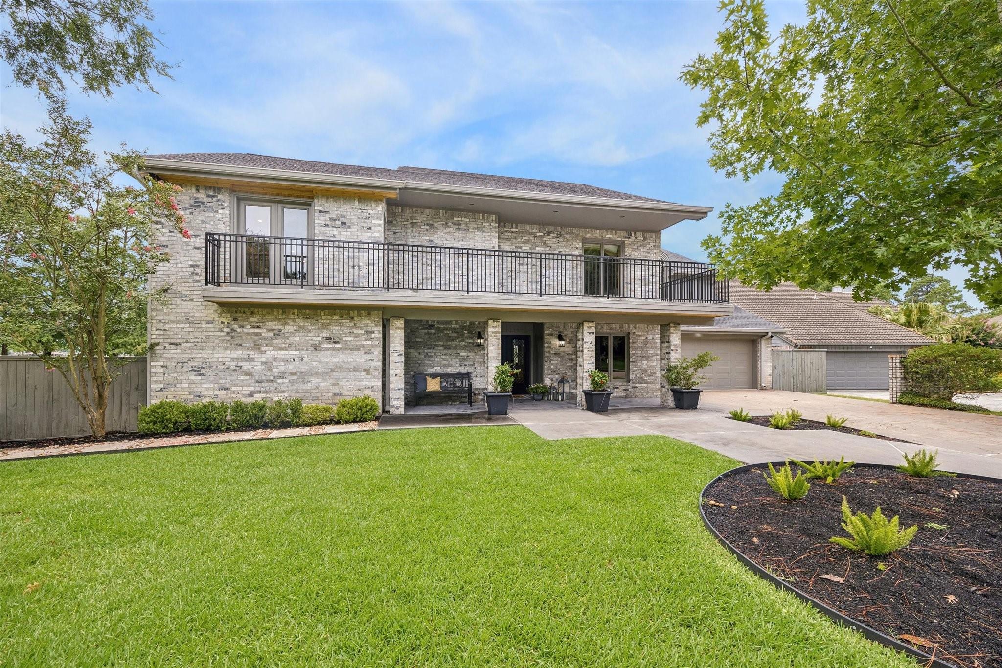 Image 2: This charming brick home features an expansive fro