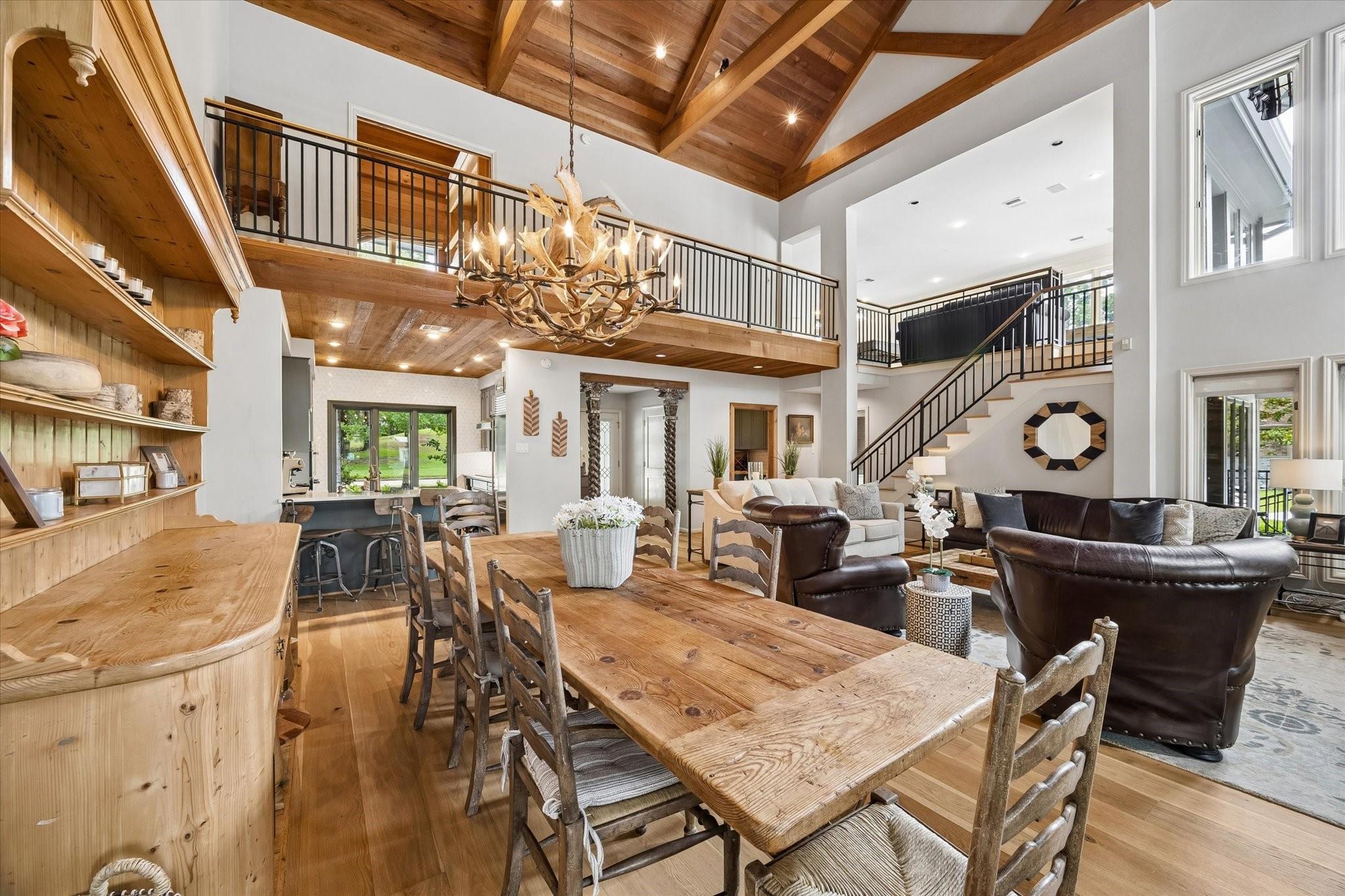 Image 4: Warm wood accents, vaulted ceilings, and striking
