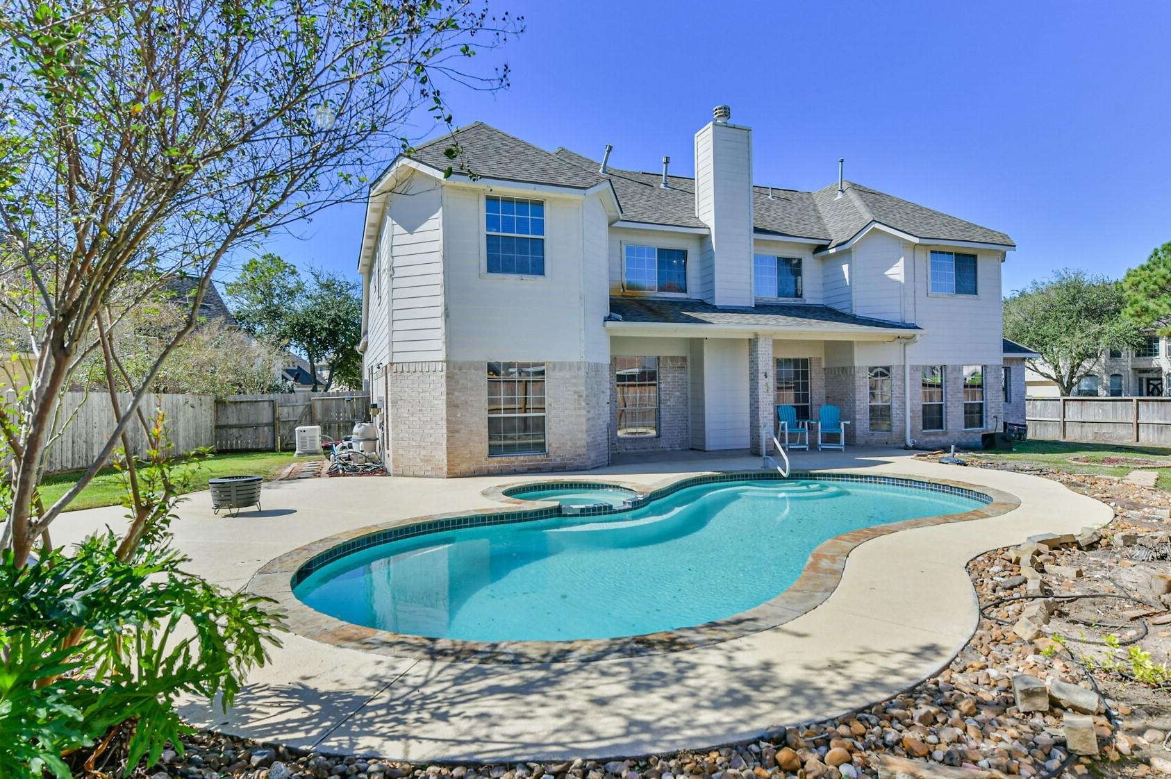 Image 1: Back of home.
