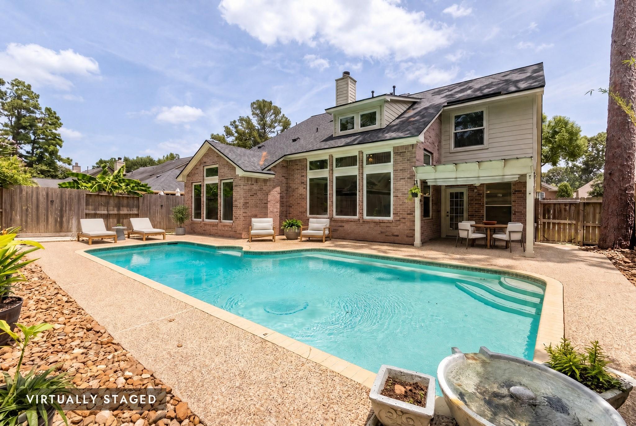 Image 2: Sparkling pool and expansive patio space, perfect