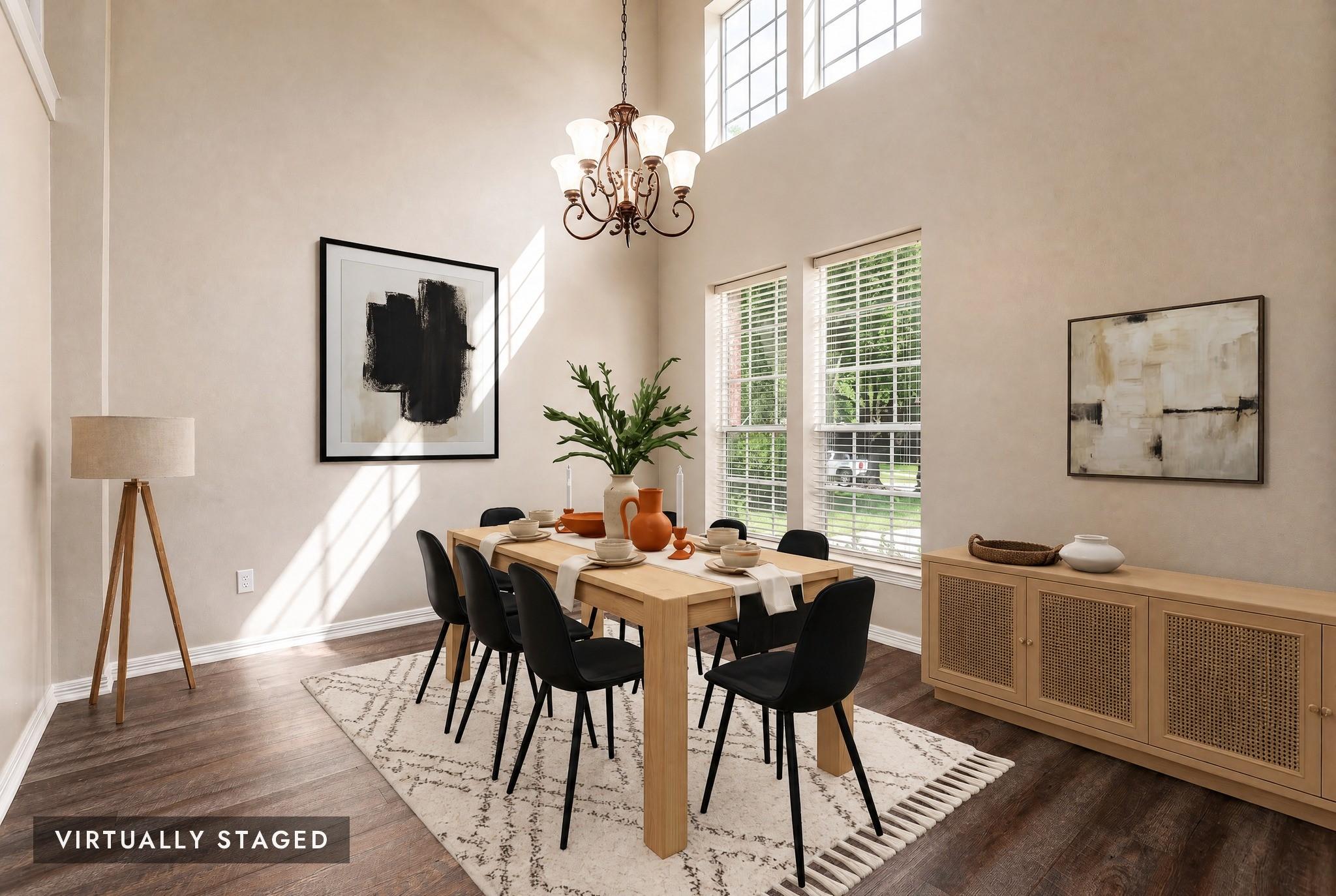 Image 4: Formal dining room, featuring soaring ceilings and