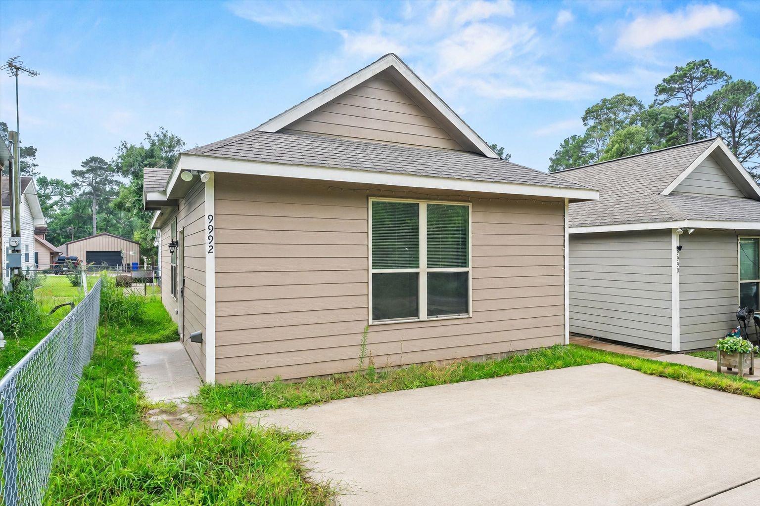 Image 2: This exterior view of 9992 Calendar Street shows t