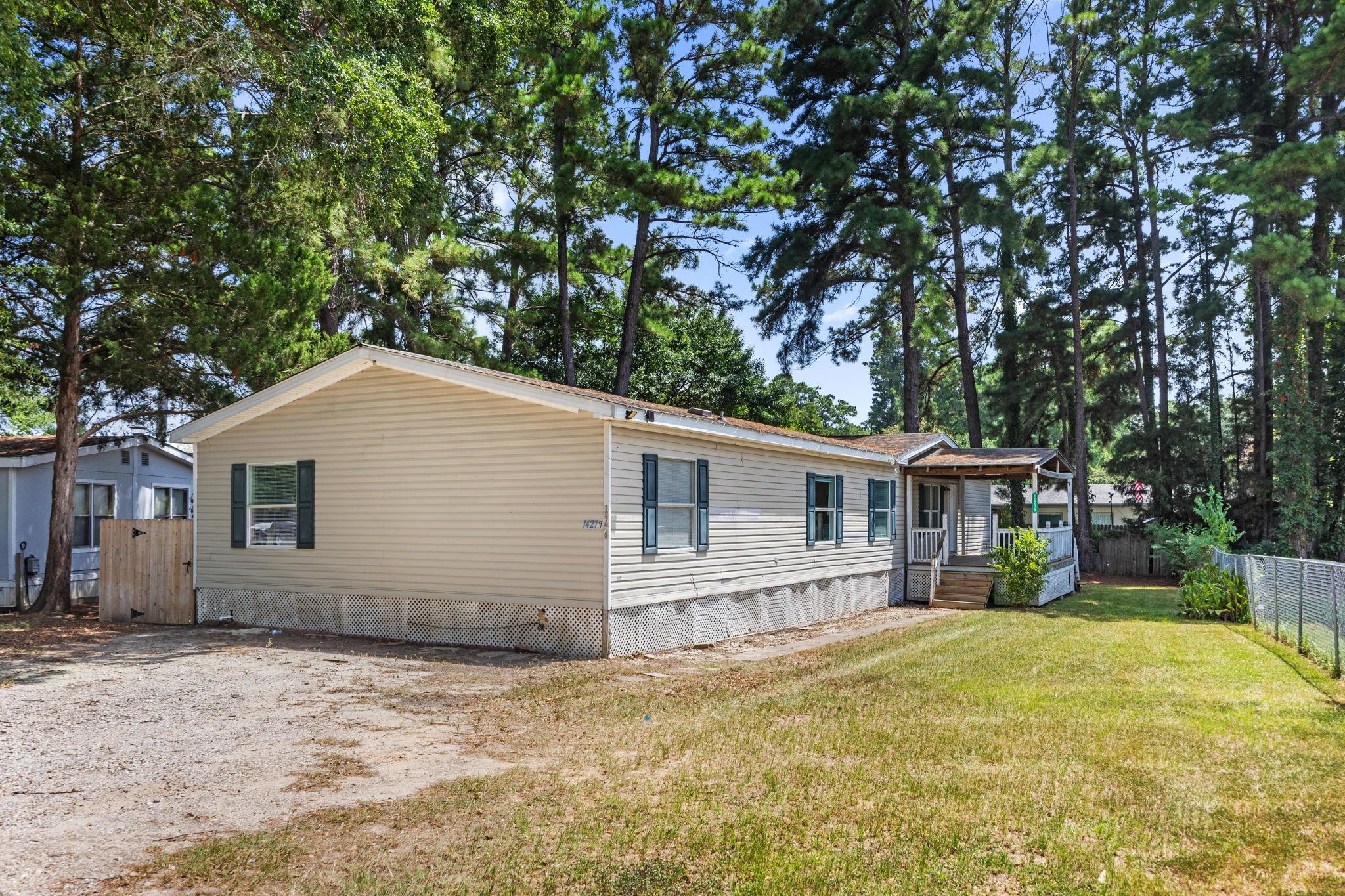 Image 2: Front elevation from the gravel drive. Front door