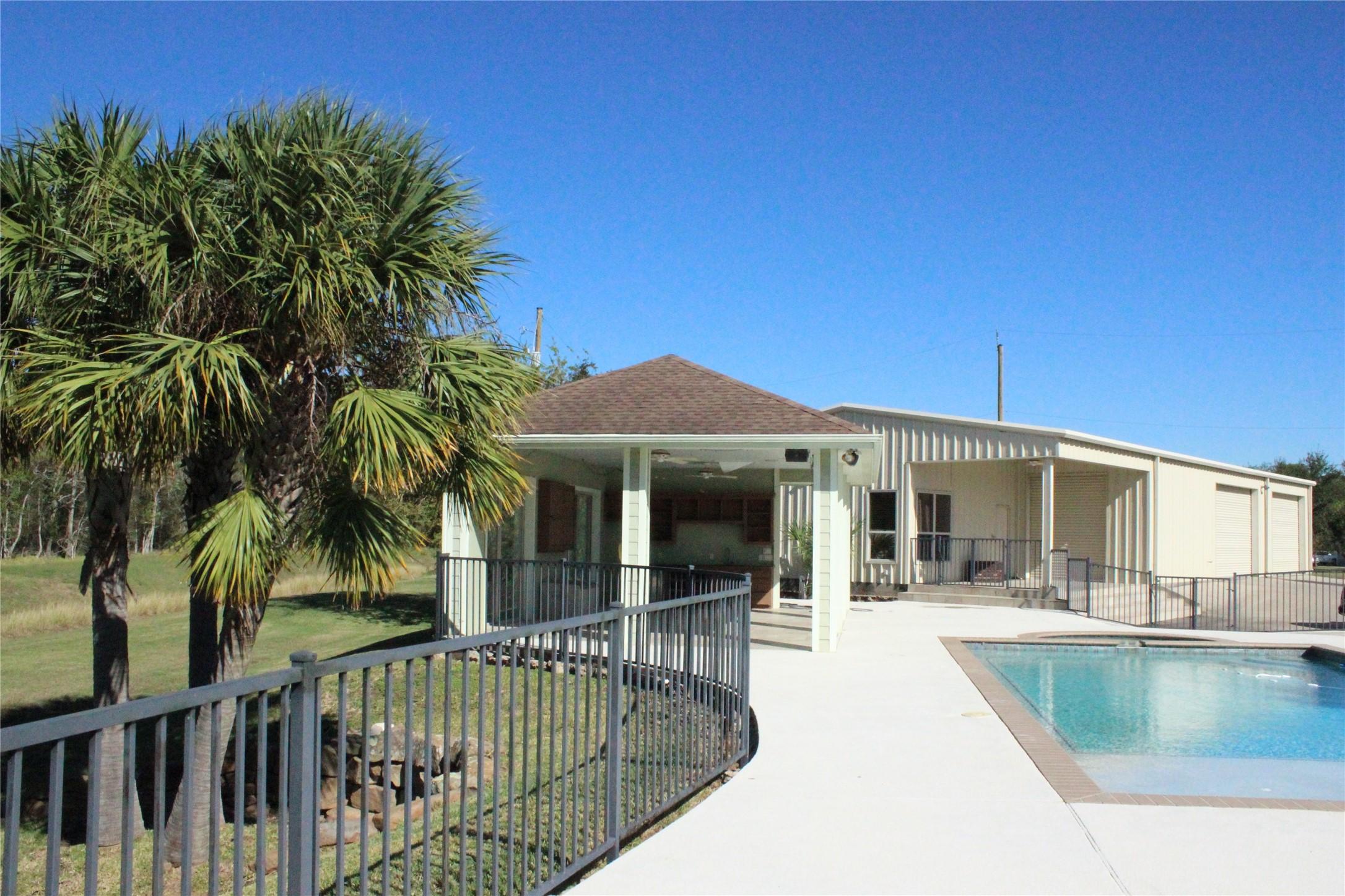 Image 1: Patio/Pool facing Barndominium