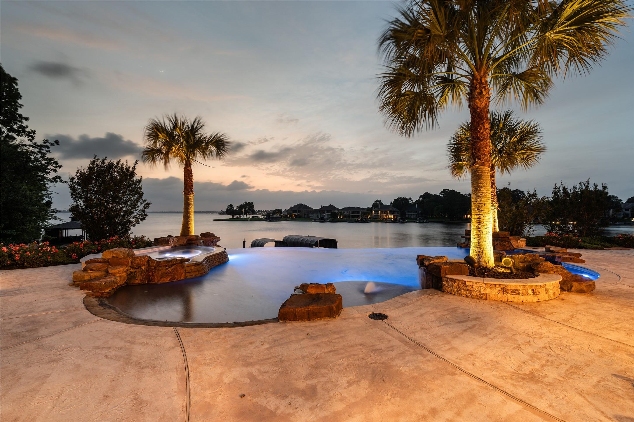 Image 3: Infinity-edge pool and spa overlook the lake, fram