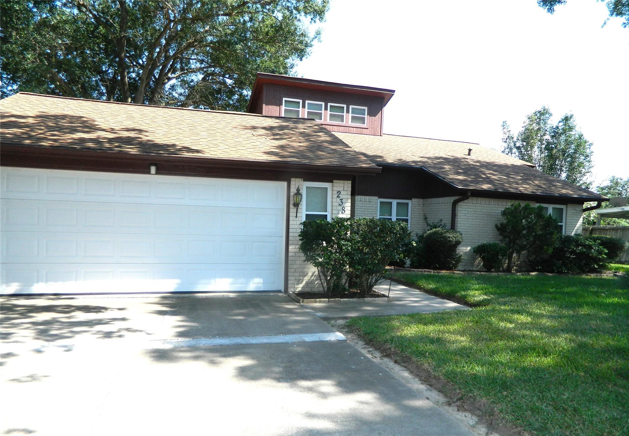 Image 2: garage front of home