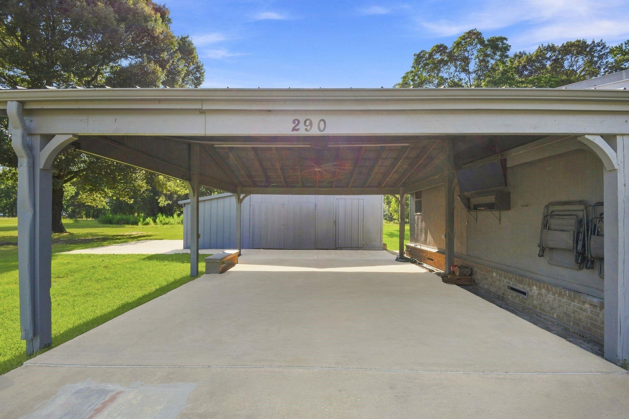 Image 2: Covered Carport with Easy Access to Detached Works