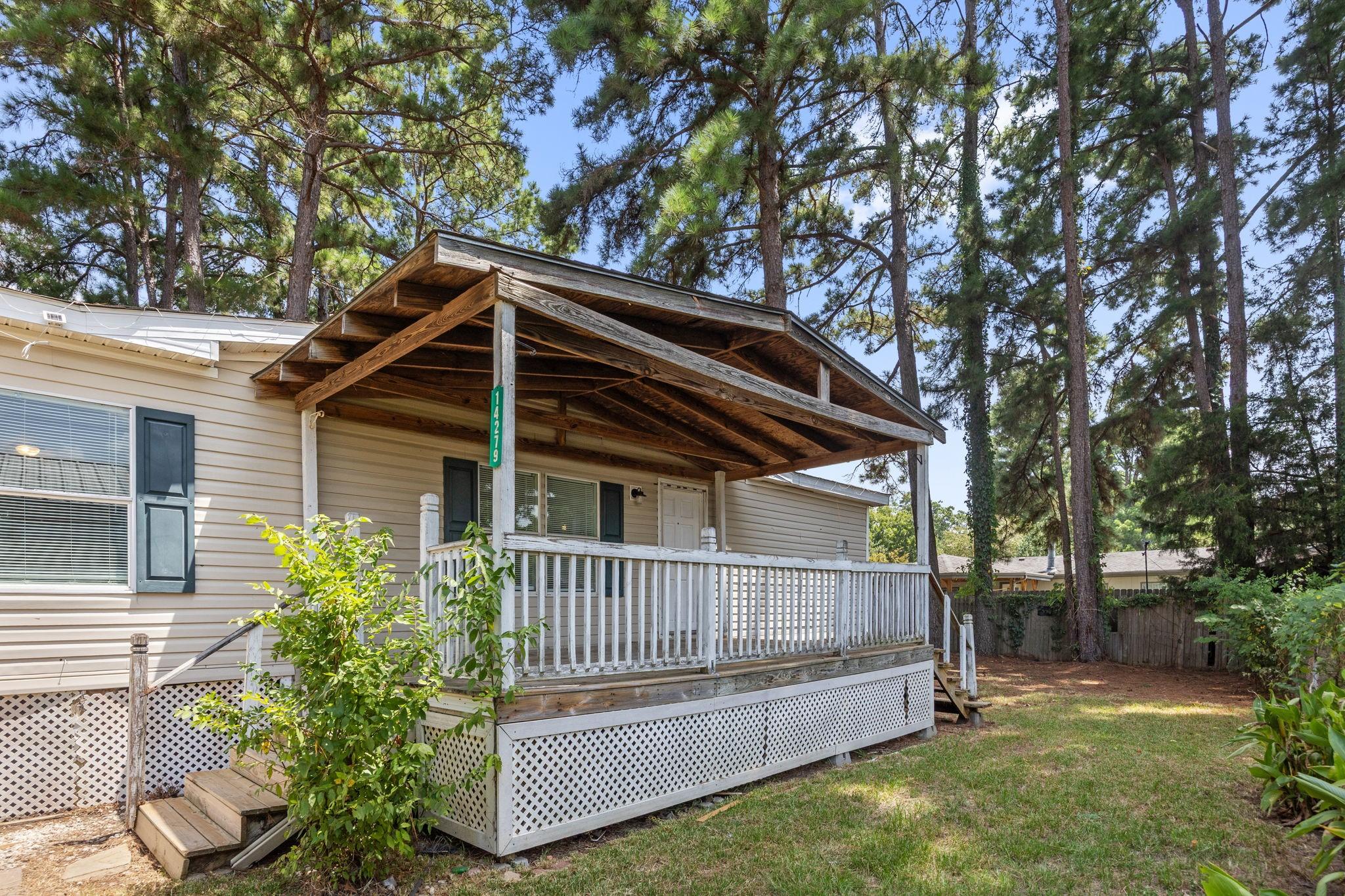 Image 3: Covered front porch at the entry.