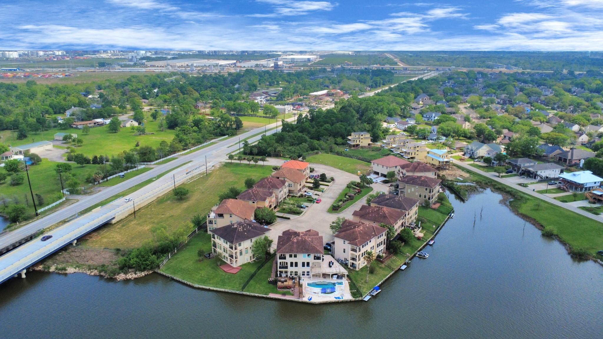 Image 4: Serene waterfront community with a cluster of town