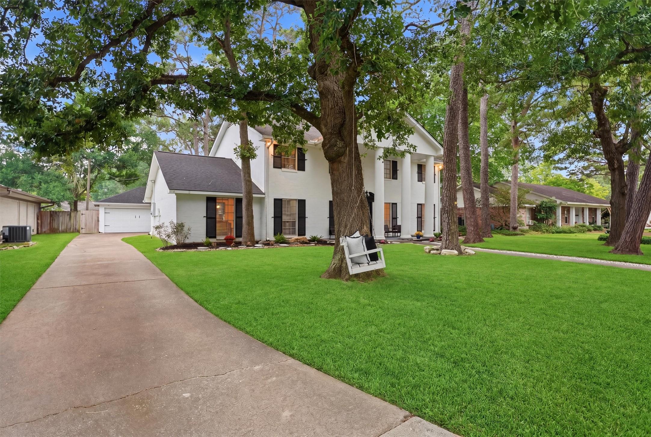 Image 2: Beautifully positioned beneath mature trees, this