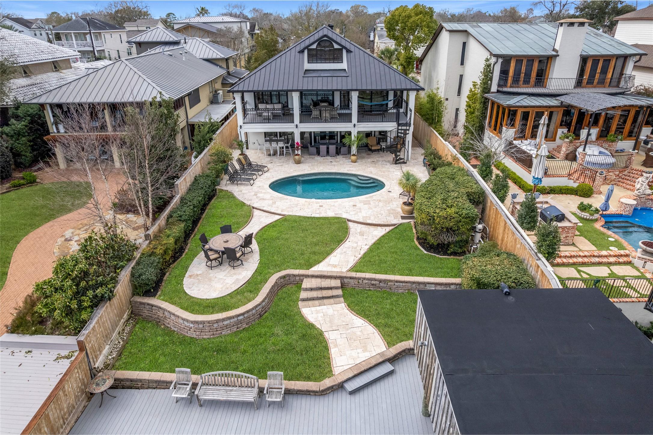 Image 3: Fully fenced backyard oasis offers an exceptional