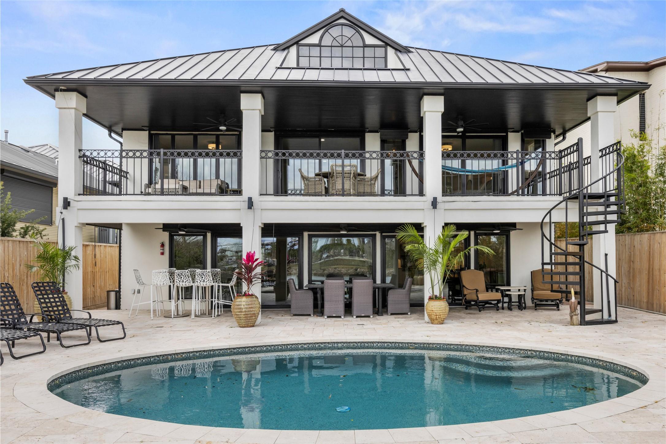 Image 4: Enjoy 2 covered patios overlooking the backyard wi