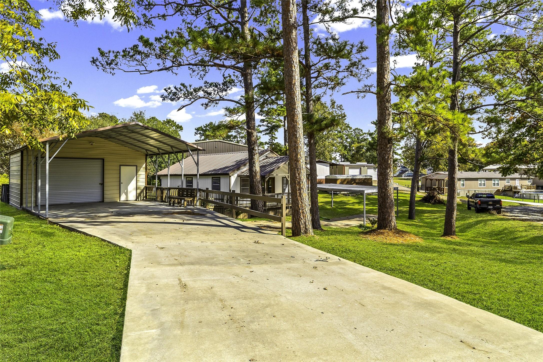 Image 4: Concrete Drive to Garage and Carport