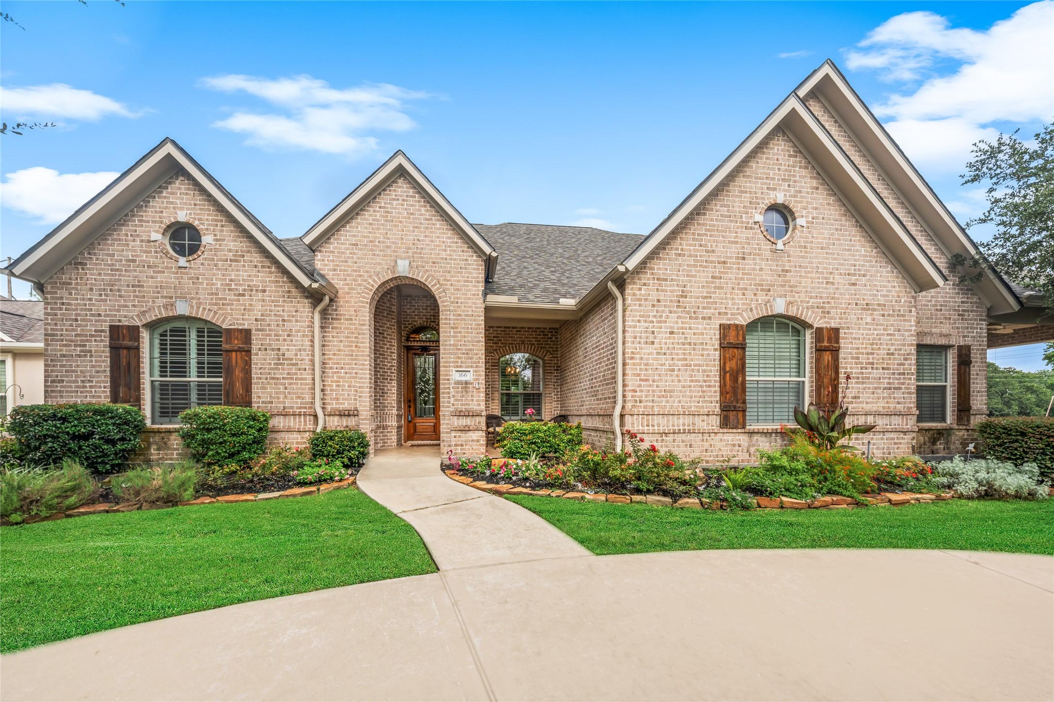 Image 1: Beautiful golf course home with timeless brick arc