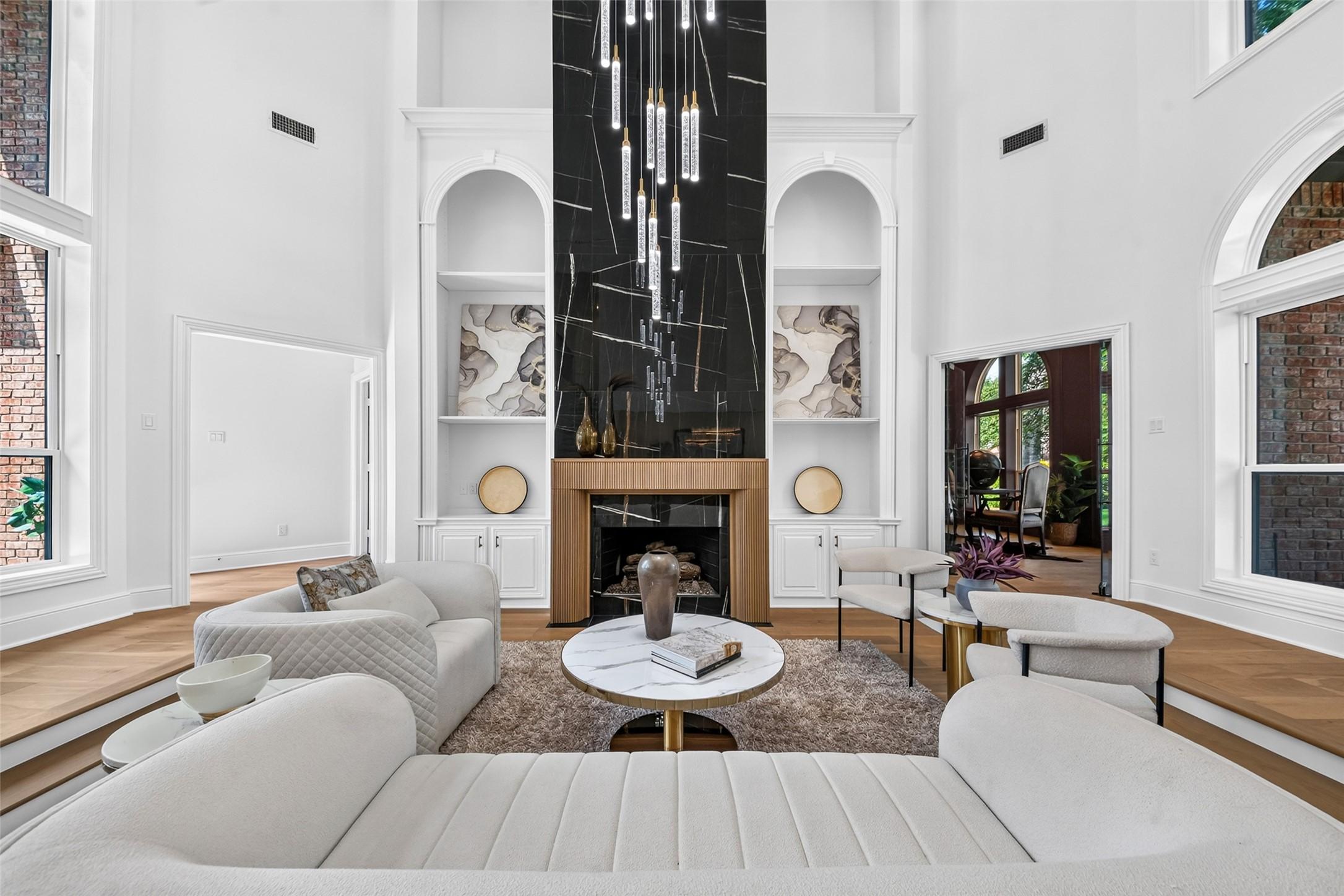 Image 3: Stunning living room with soaring ceilings, a dram