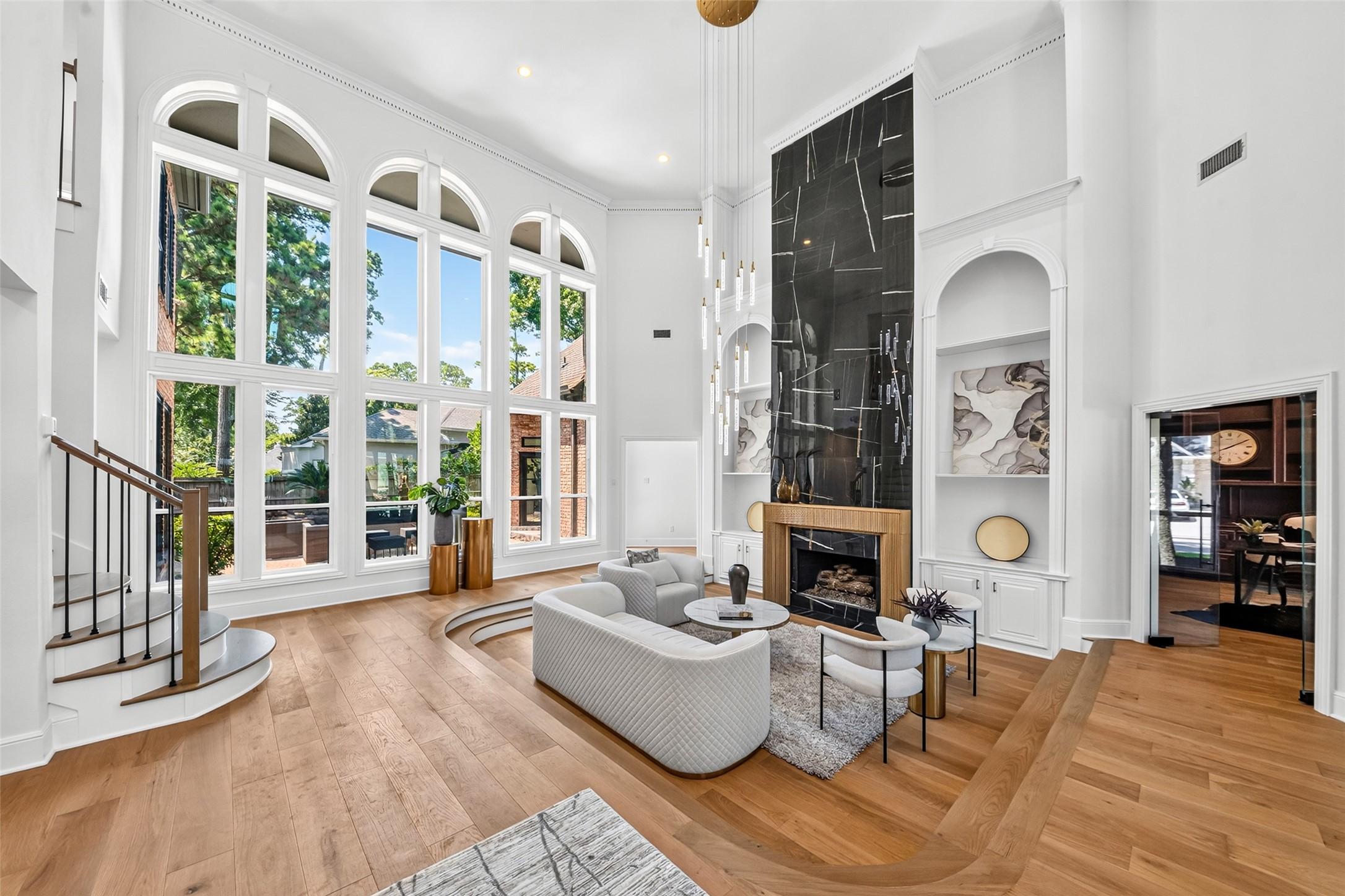Image 4: Expansive living room with soaring ceilings, drama