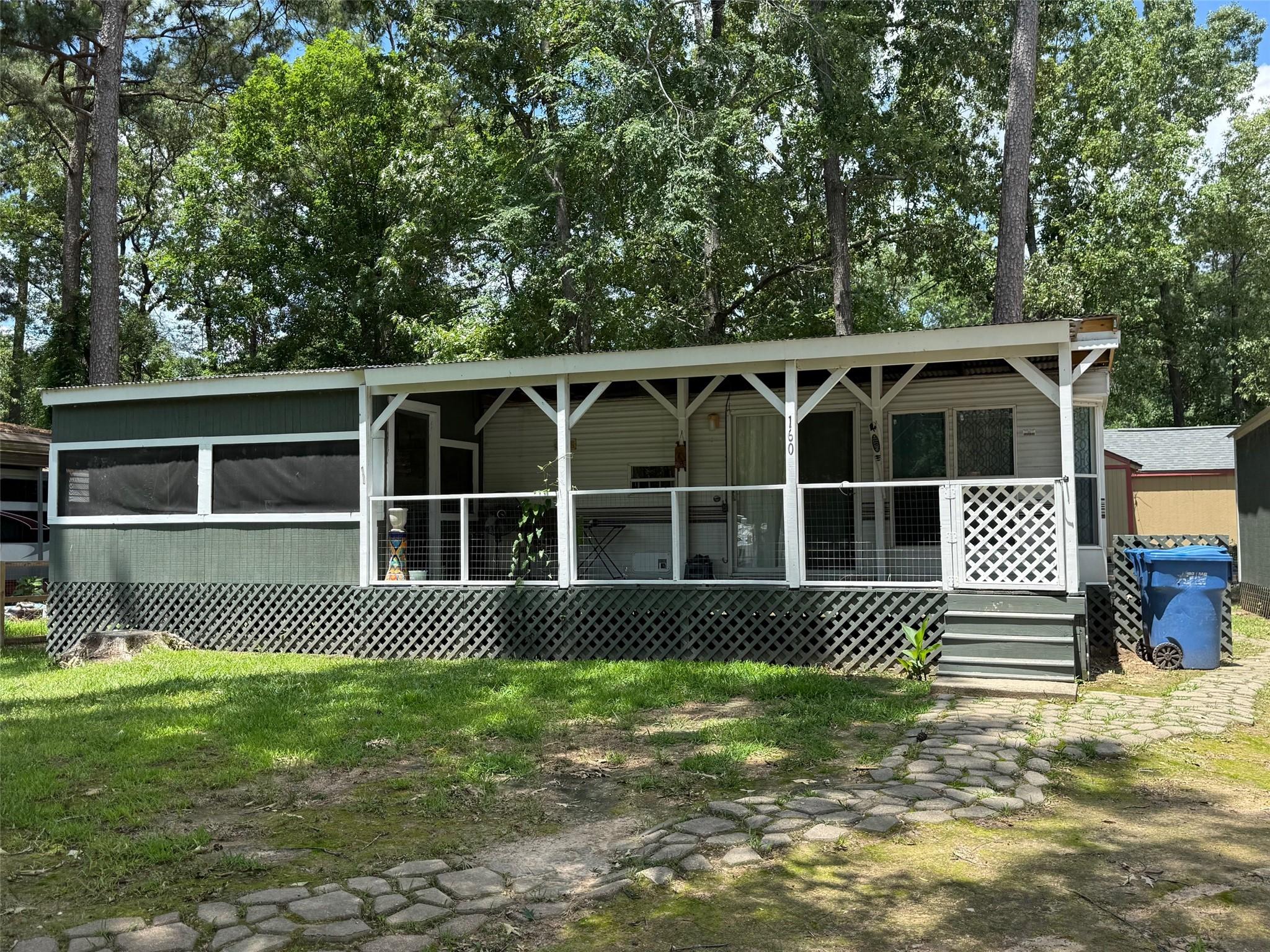 Image 1: Front of home with large porch and then into the s