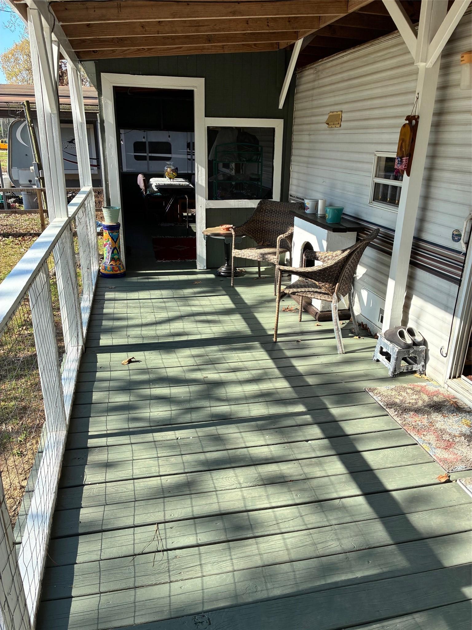 Image 3: The large front porch.  See bottom corner of main