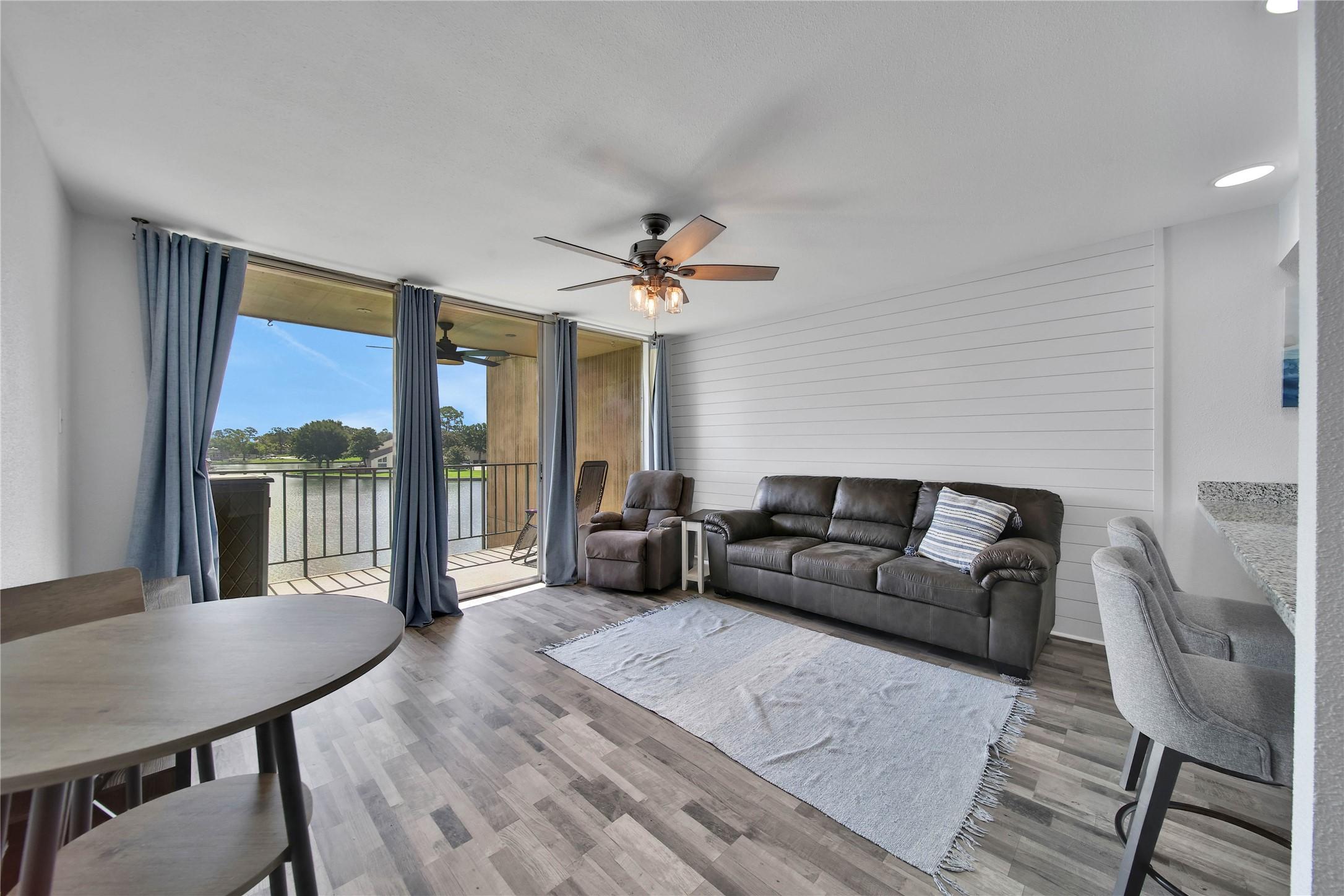 Image 3: Continuous wood-look laminate flooring enhances th