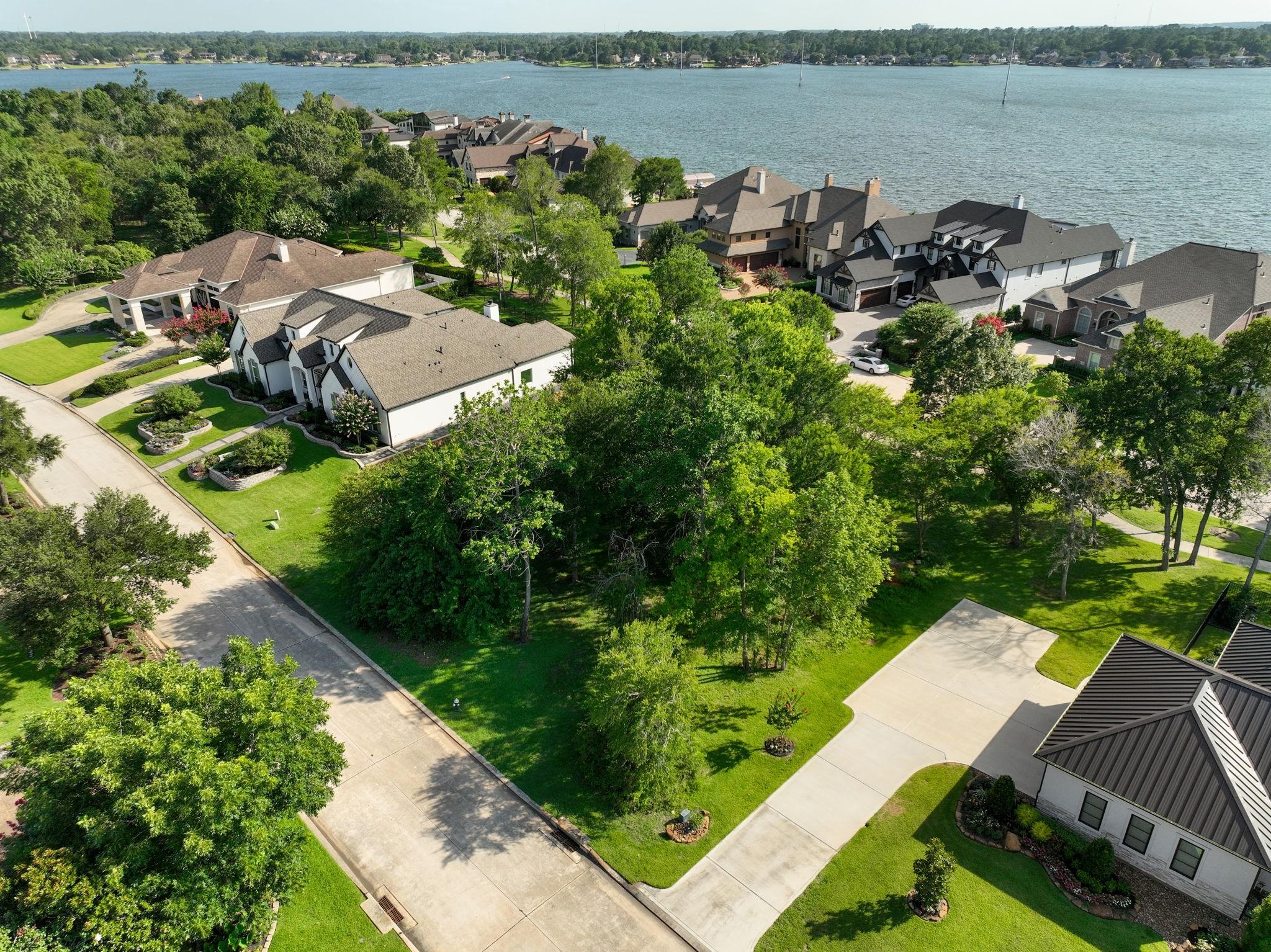 Image 3: Mature hardwoods and impeccable views await.