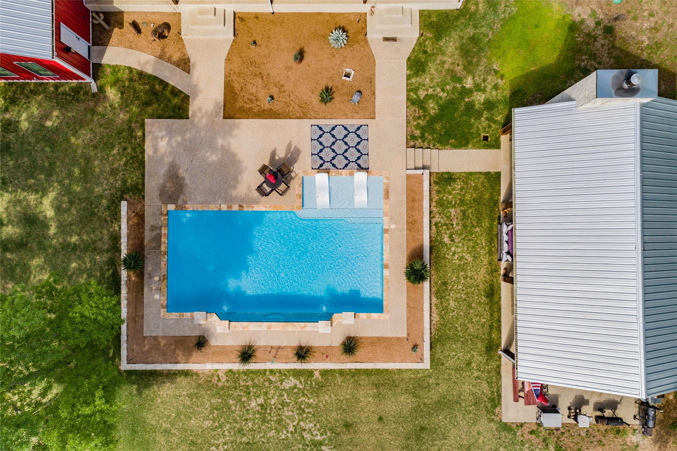 Image 2: Aerial view of the pool and outdoor party pavilion