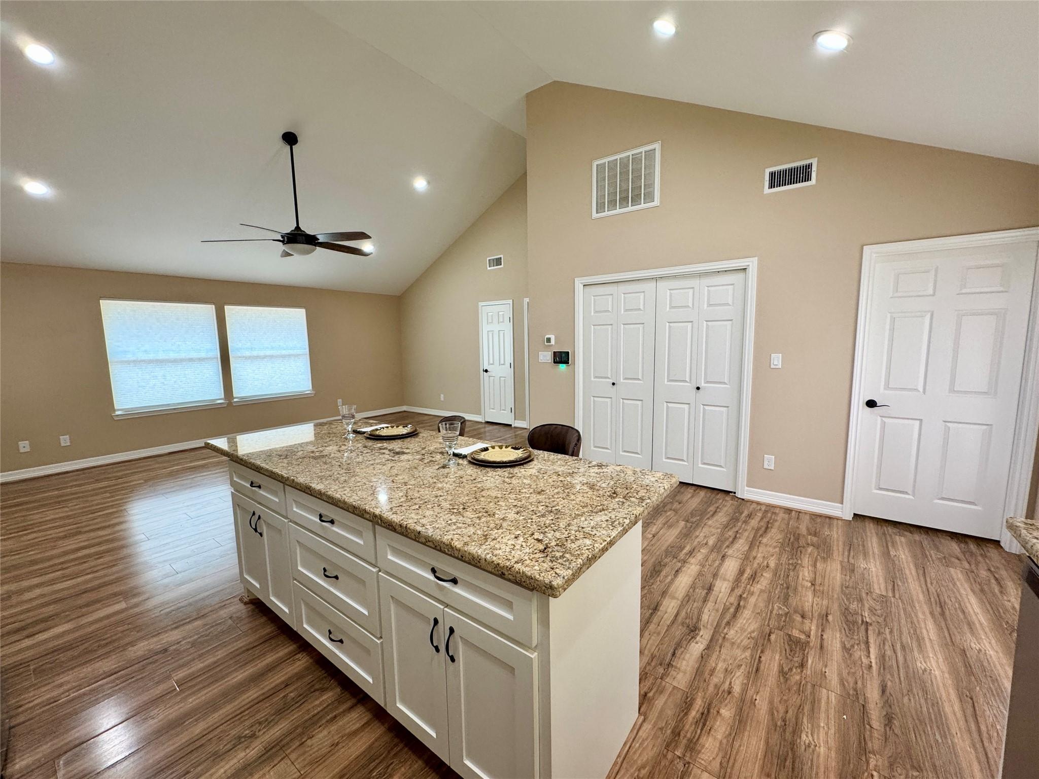 Image 3: From the kitchen looking toward the dining and liv